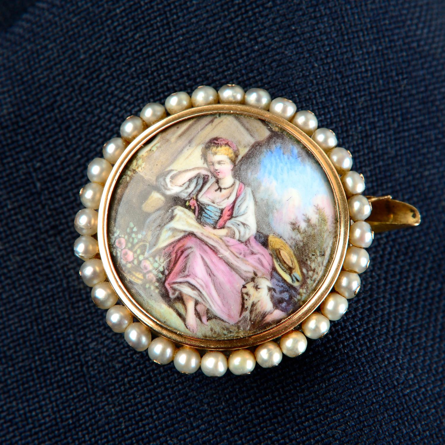 A mid to late 19th century gold mounted enamel scenic brooch of a woman in pastoral setting,