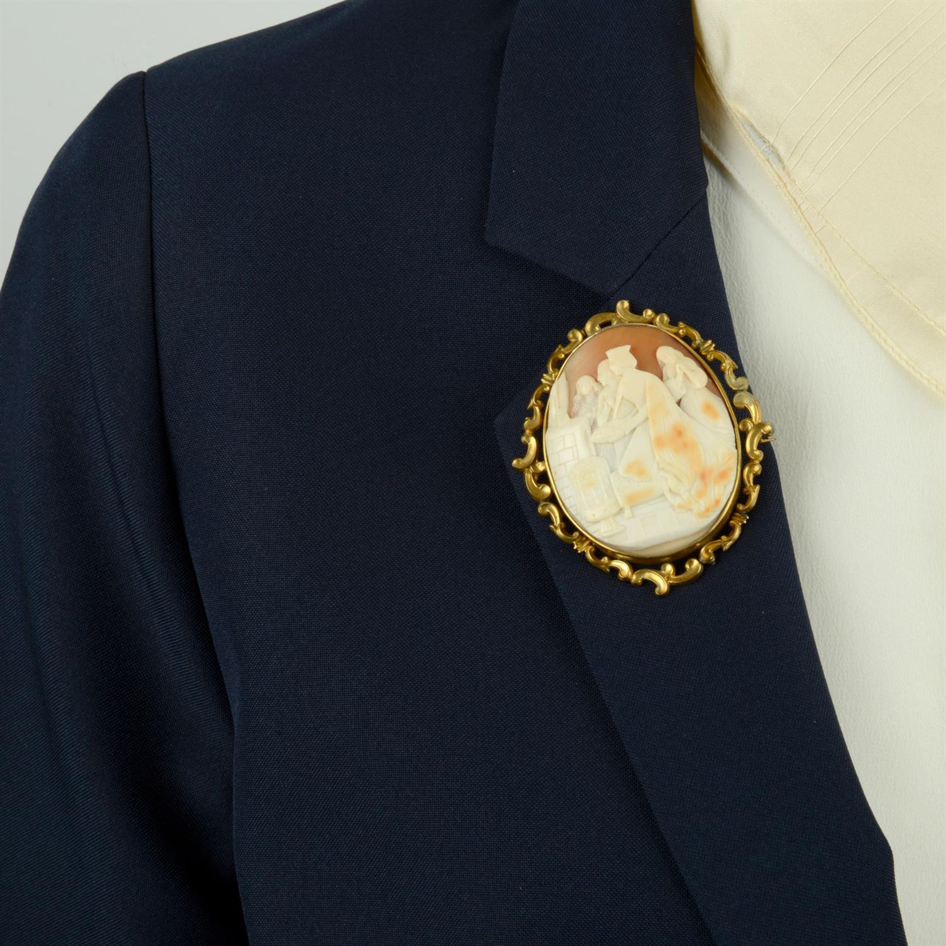 A late Victorian gold mounted shell cameo brooch, carved to depict a Queen, possibly giving - Image 6 of 6