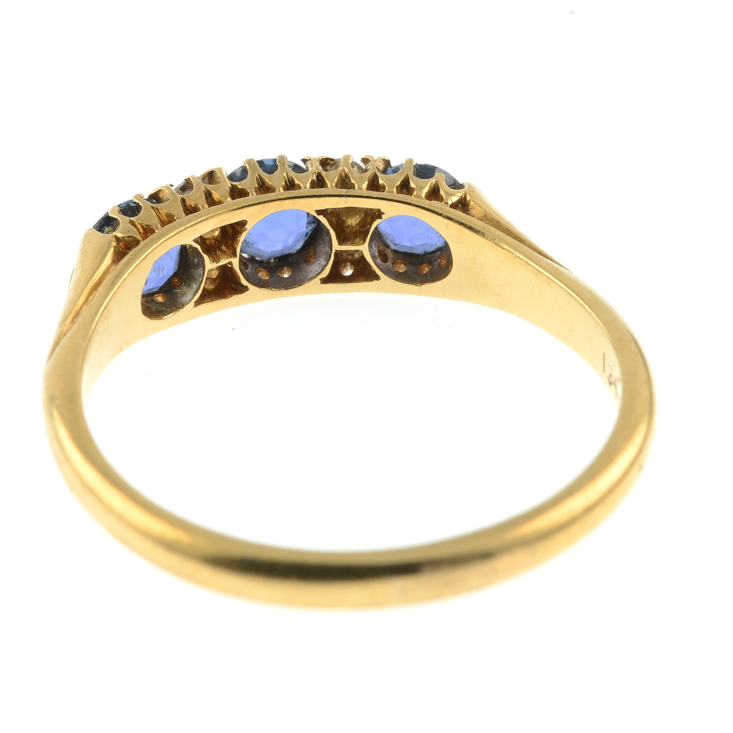 An early 20th century 18ct gold sapphire three-stone ring, with old-cut diamond double spacers. - Image 4 of 5