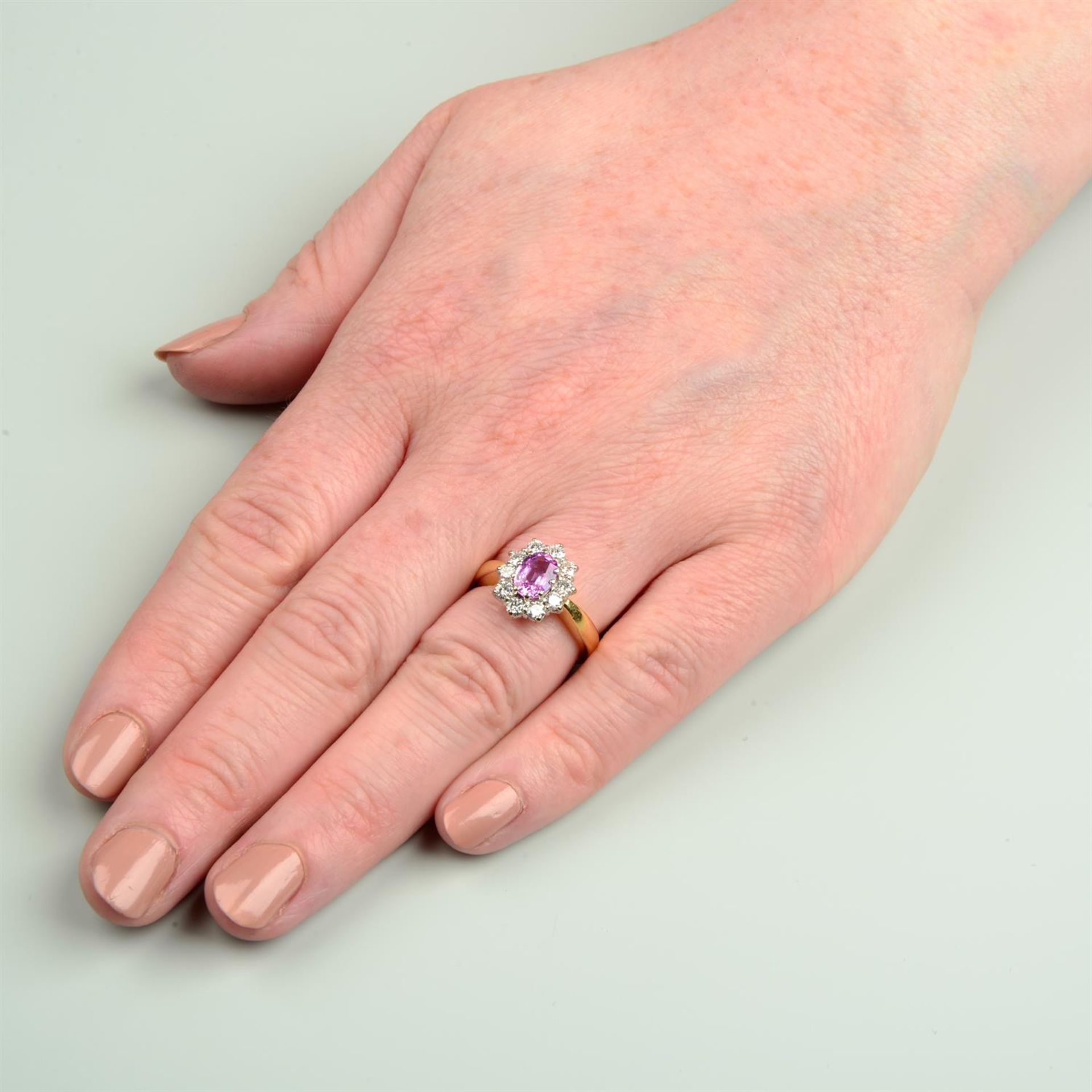 An 18ct gold pink sapphire and brilliant-cut diamond cluster ring. - Image 5 of 5