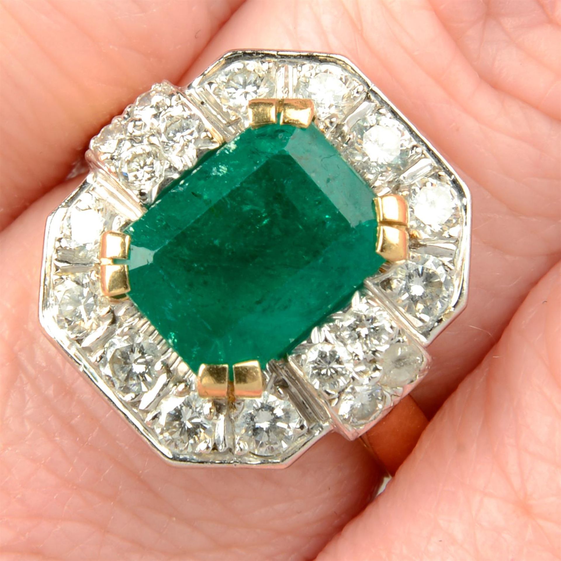 An emerald and brilliant-cut diamond geometric dress ring.