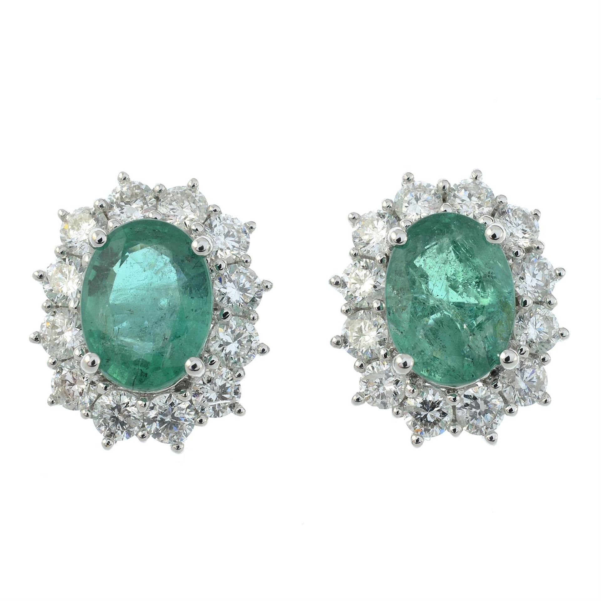 A pair of 18ct gold emerald and brilliant-cut diamond cluster earrings. - Image 2 of 3