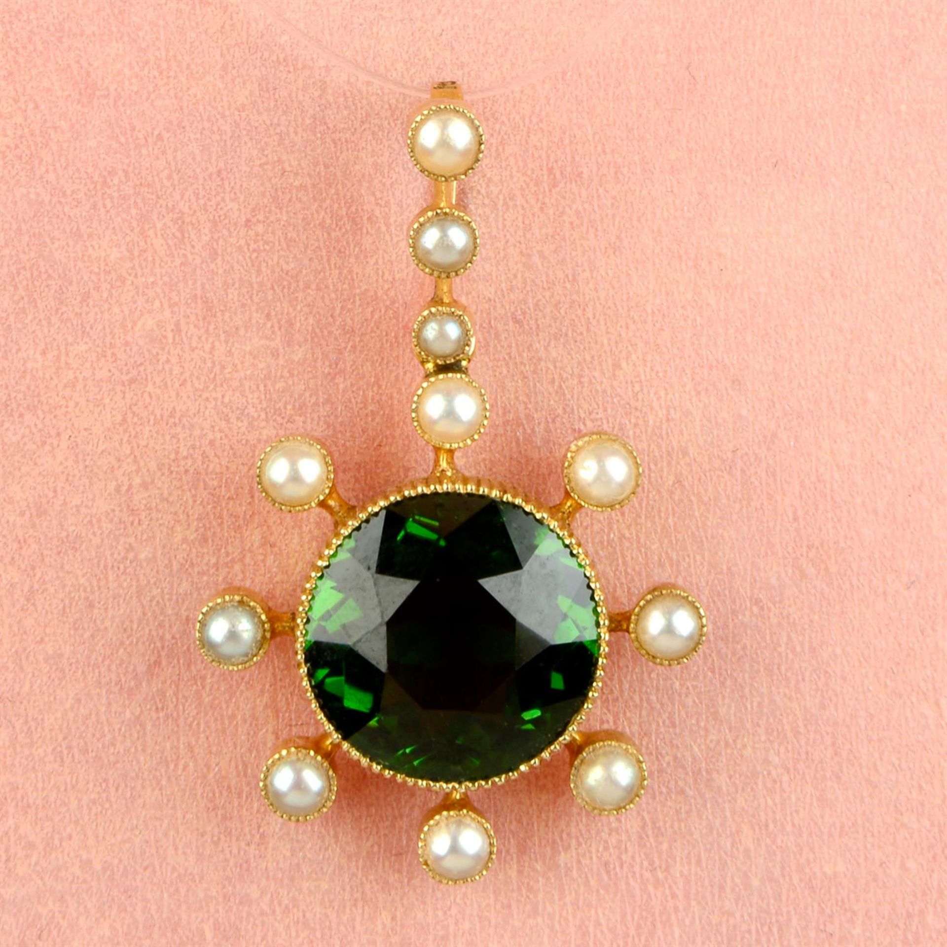 A late Victorian 15ct gold green tourmaline and split pearl pendant.