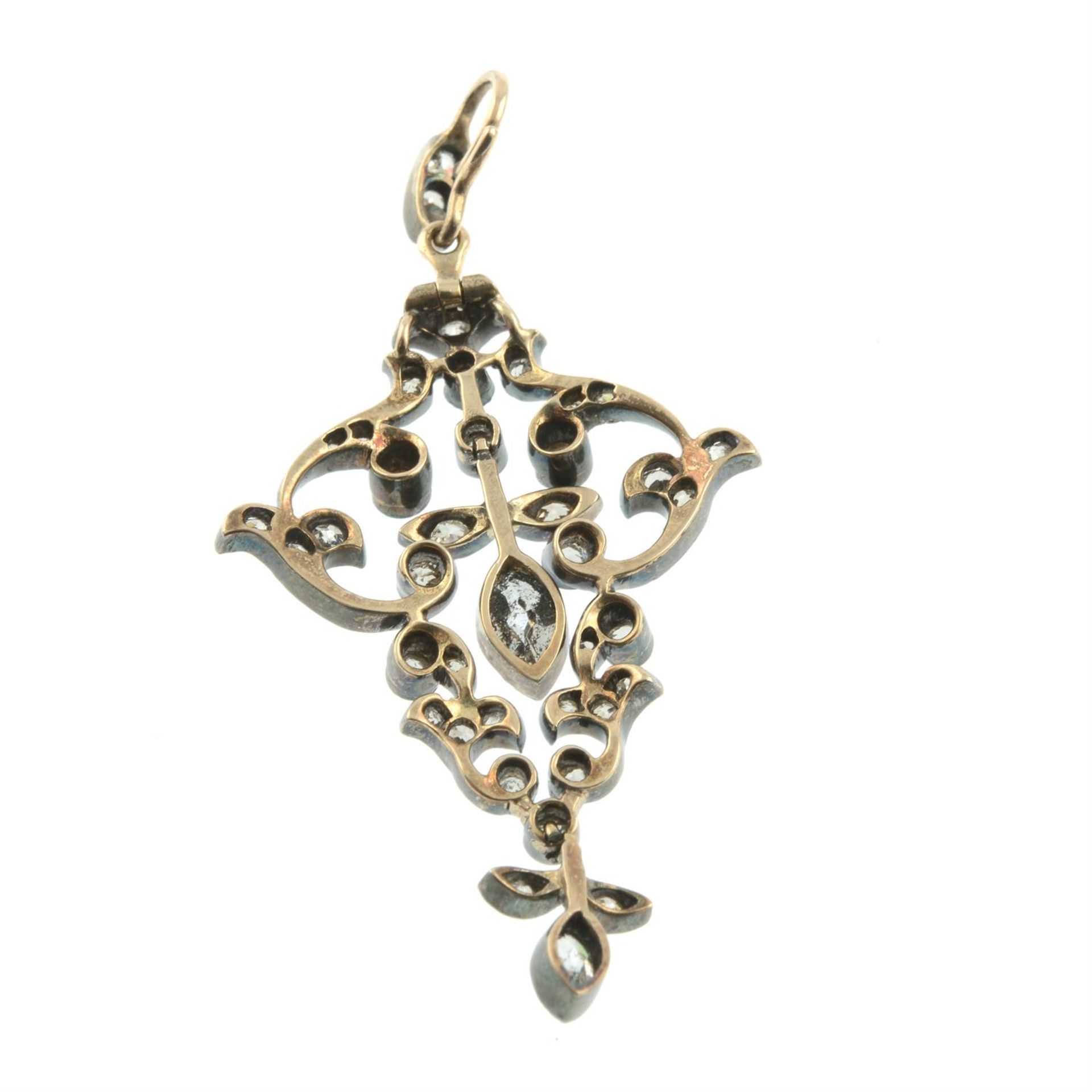 A late 19th century silver and gold old-cut and marquise-shape diamond scrolling foliate pendant. - Image 3 of 4