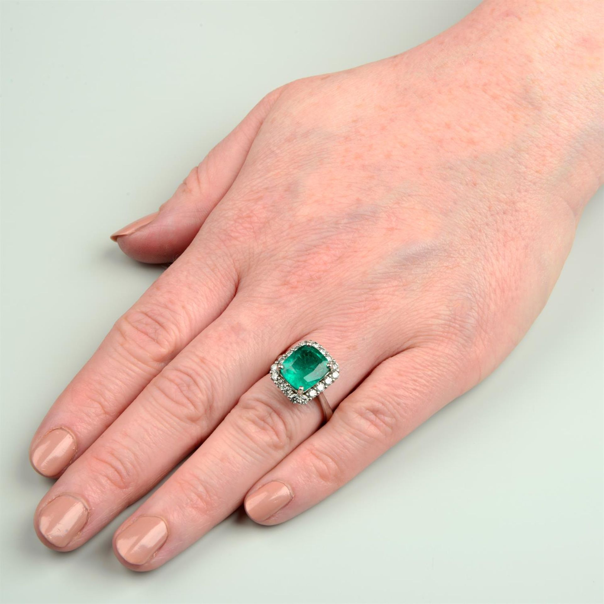 An 18ct gold emerald and brilliant-cut diamond cluster ring. - Image 5 of 5
