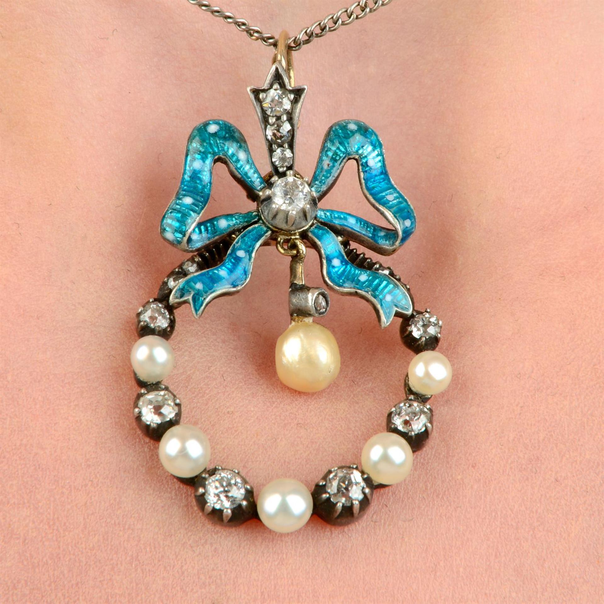 A late Victorian silver and gold, old-cut diamond, pearl and blue enamel bow and garland pendant,