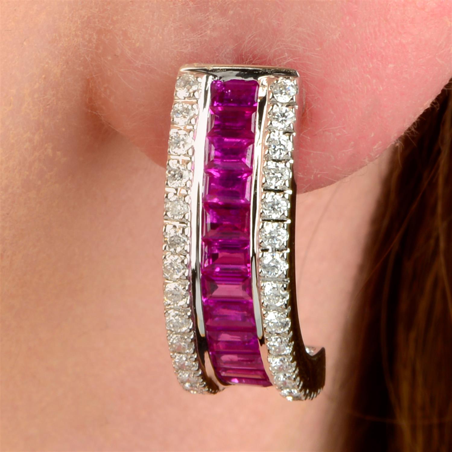 A pair of 18ct gold ruby and brilliant-cut diamond earrings.