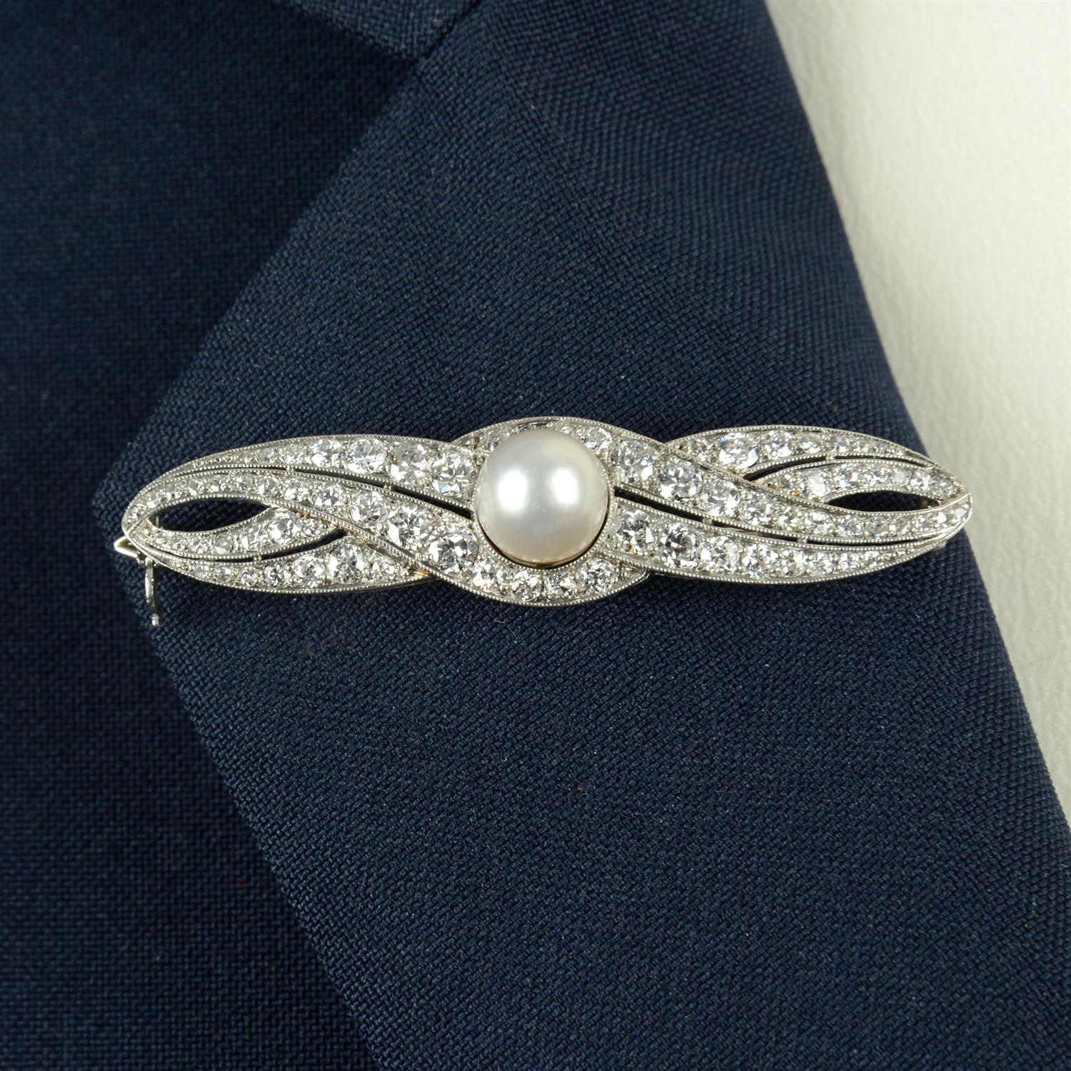 An early 20th century platinum natural pearl and circular-cut diamond brooch.