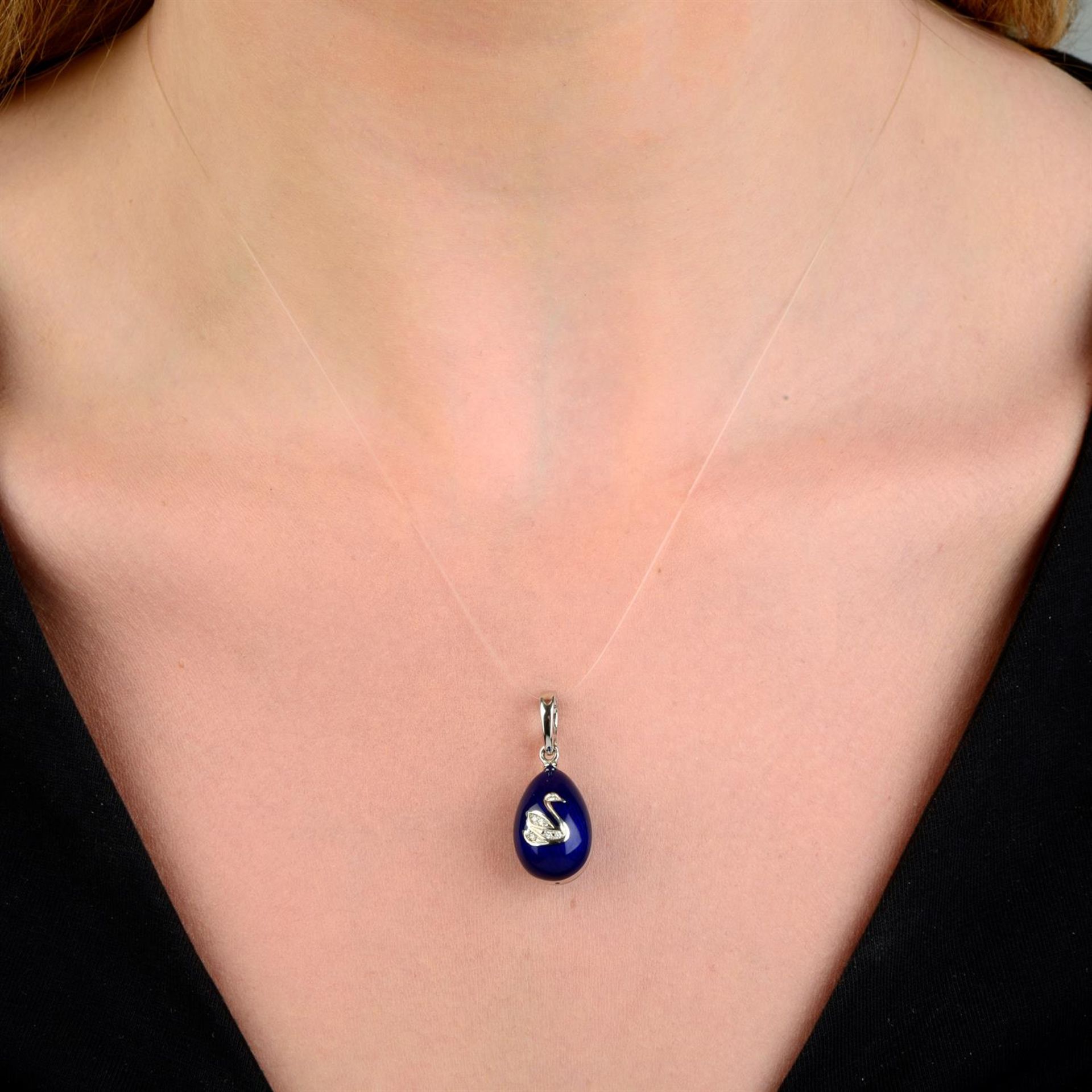 A limited edition 18ct gold blue enamel egg pendant, with diamond swan highlight, by Fabergé. - Image 5 of 5