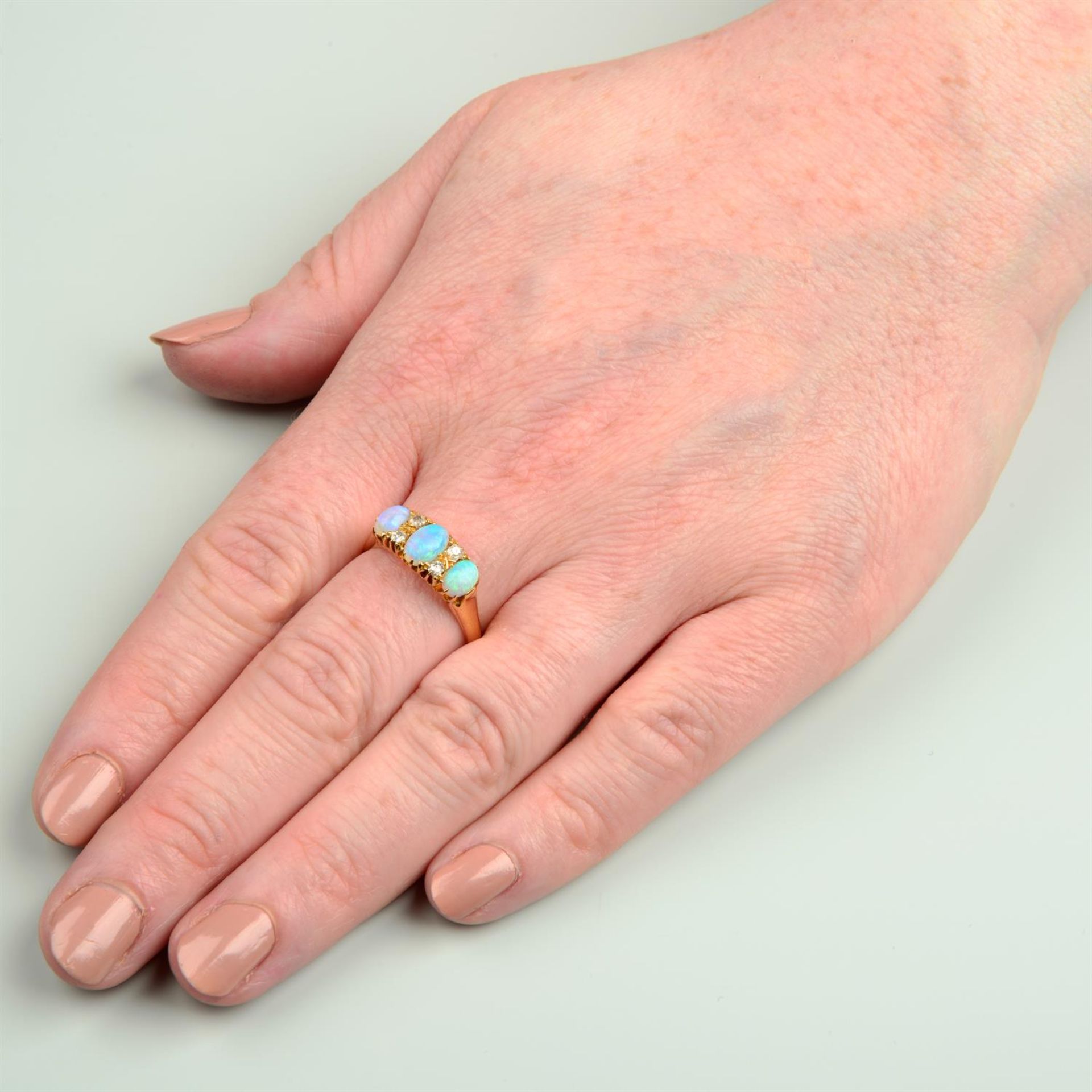 A late Victorian 18ct gold opal three-stone ring, with old-cut diamond spacers. - Image 5 of 5