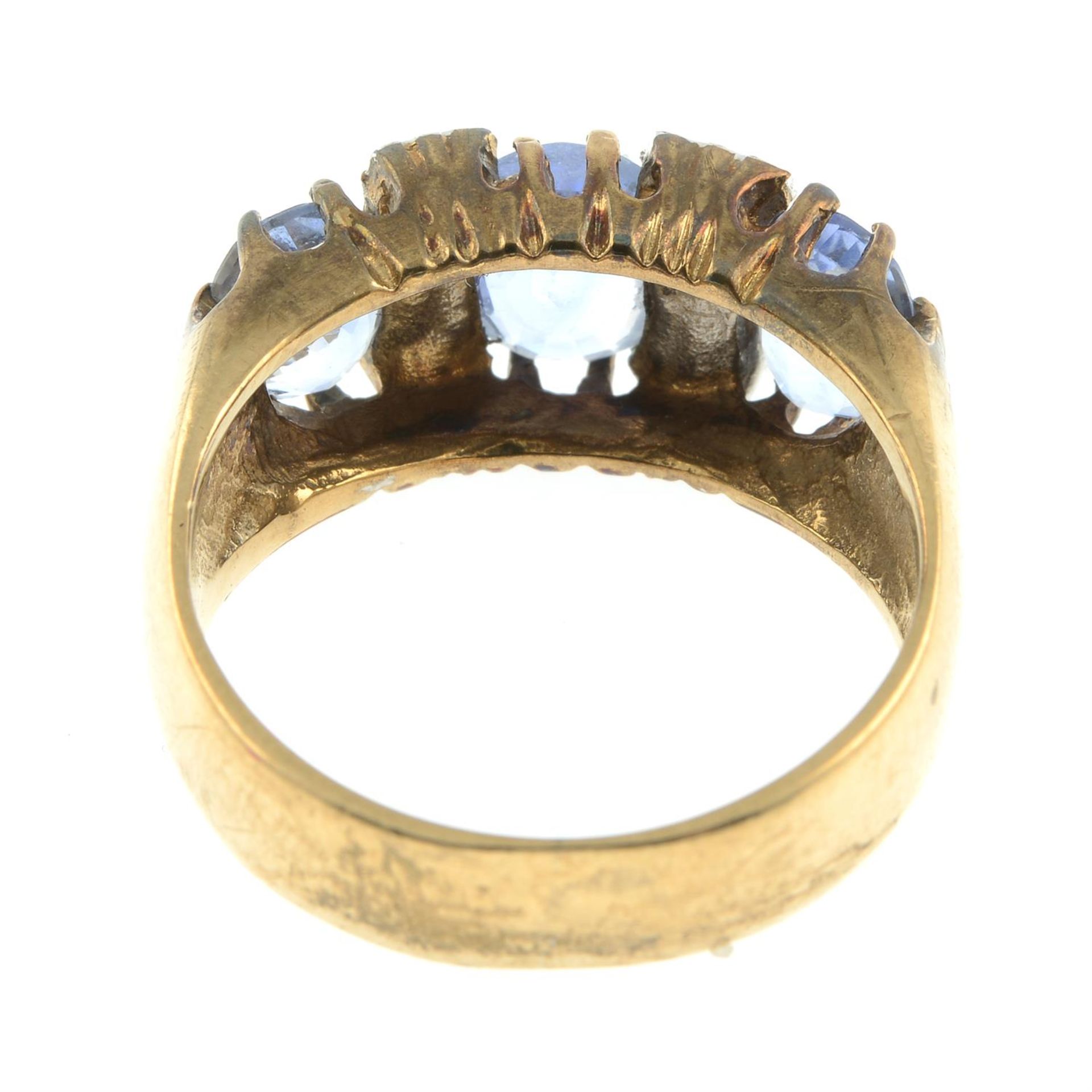 A 9ct gold sapphire three-stone ring, with brilliant-cut diamond spacers. - Image 4 of 5