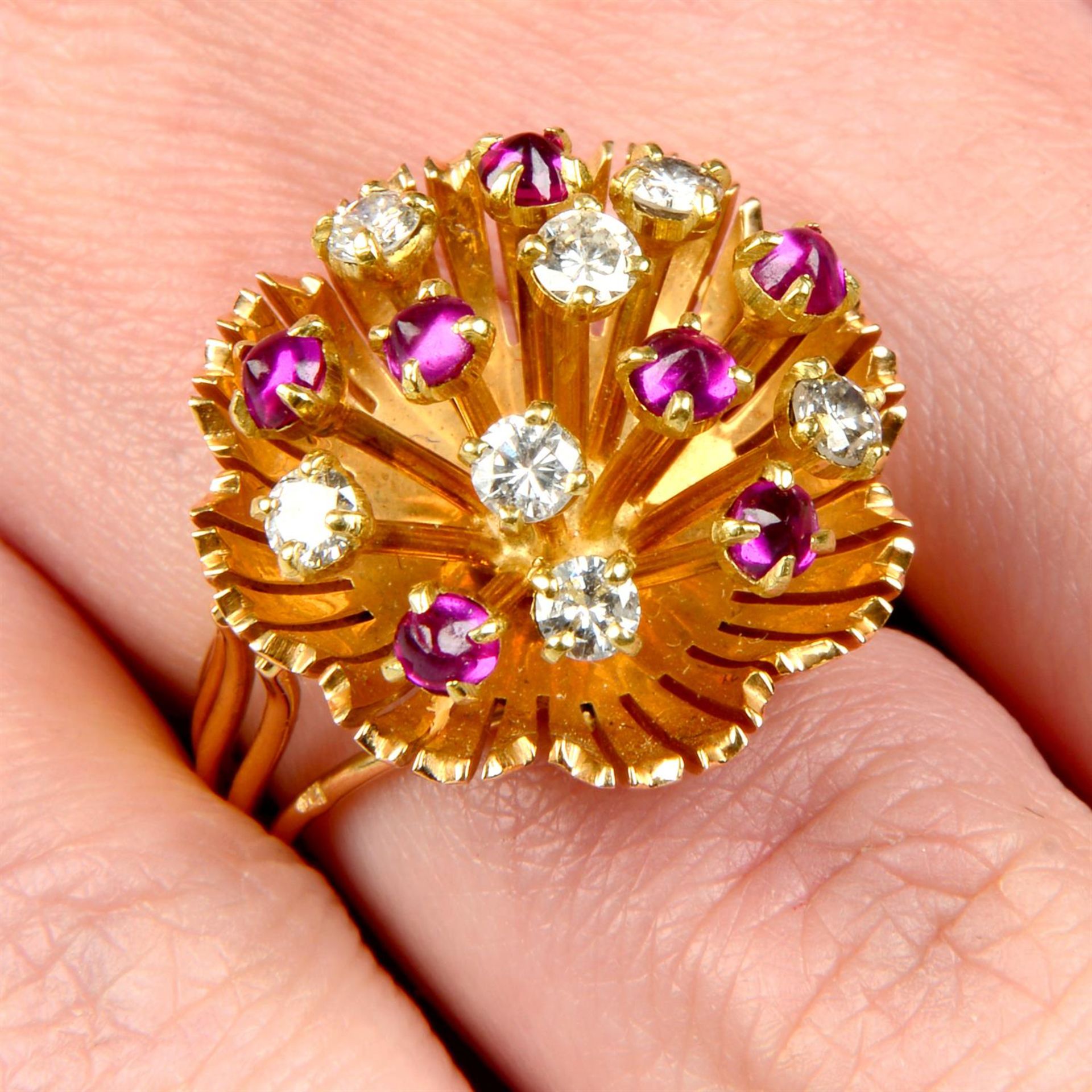 A mid 20th century 18ct gold brilliant-cut diamond and ruby cabochon floral dress ring.