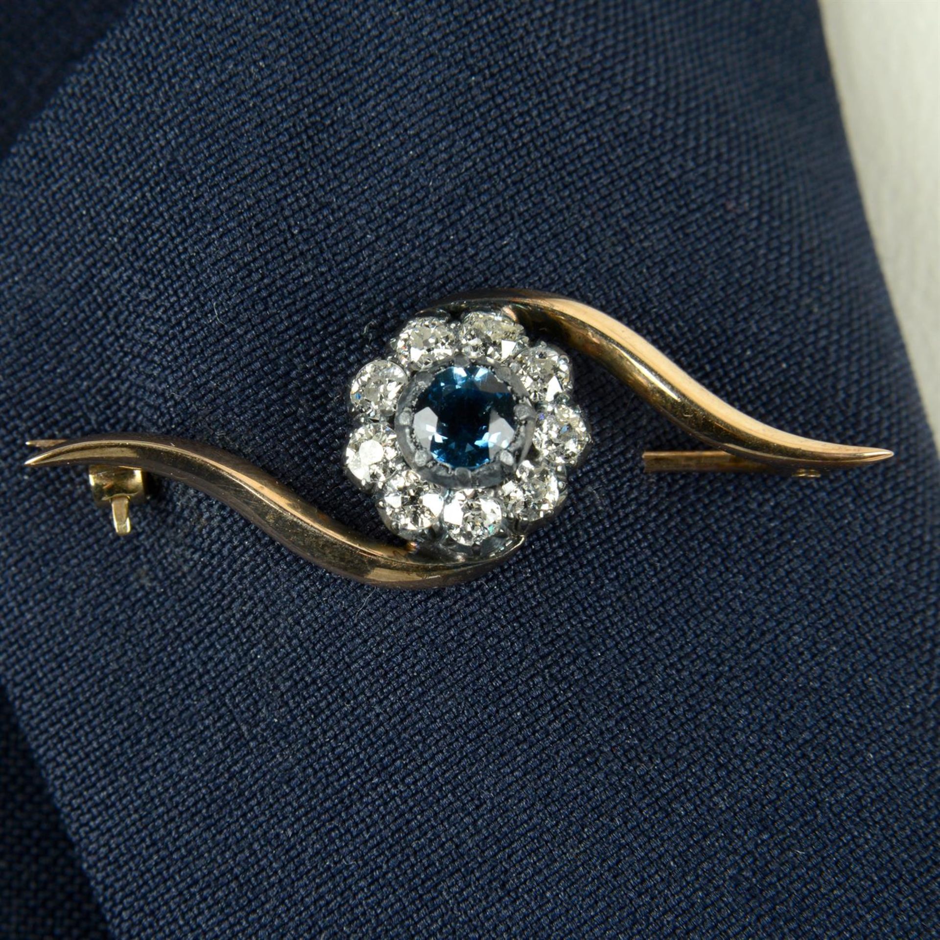 A late Victorian silver and gold, sapphire and old-cut diamond cluster brooch.