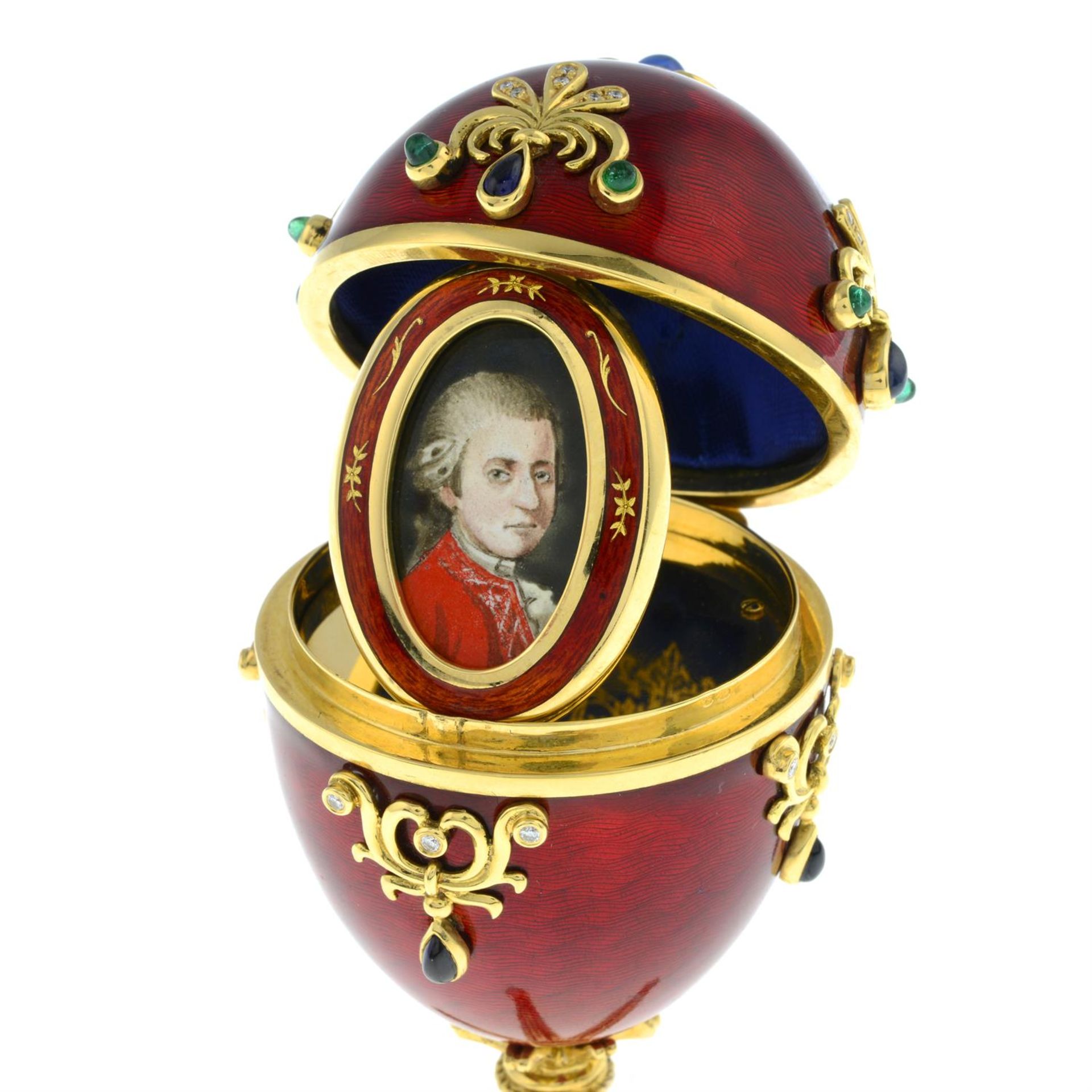 A limited edition red enamel and multi-gem egg sculpture, with hinged portrait interior, - Image 5 of 7