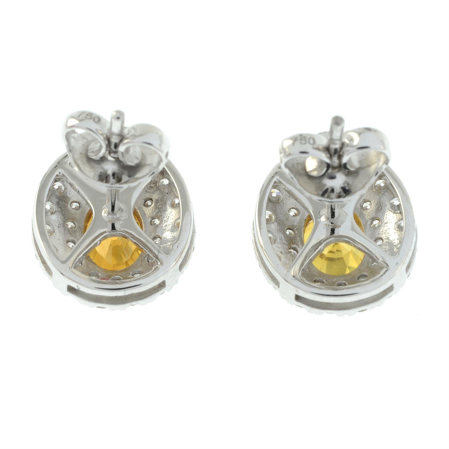 A pair of yellow sapphire and pave-set brilliant-cut diamond cluster earrings. - Image 3 of 4