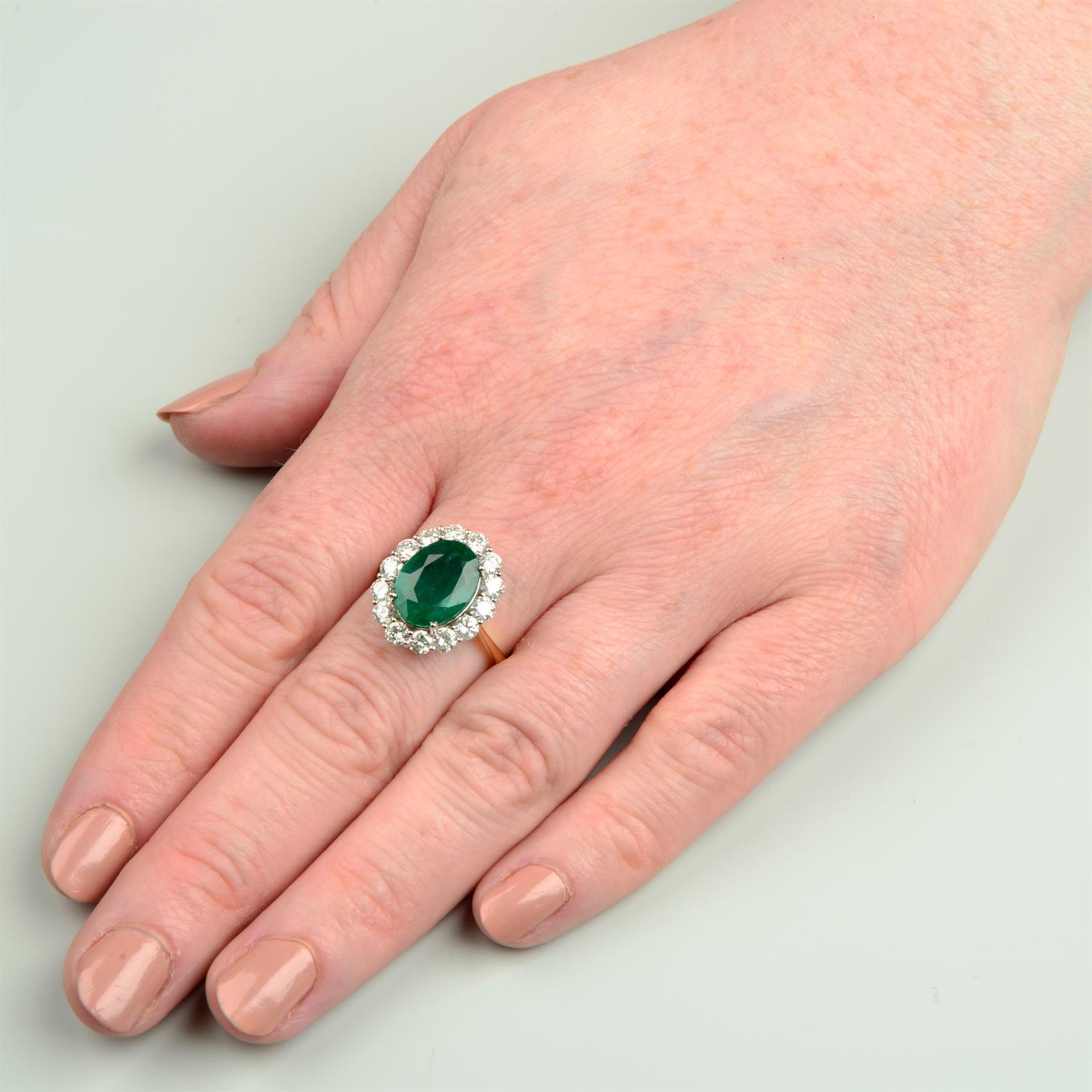 An 18ct gold emerald and brilliant-cut diamond cluster ring. - Image 6 of 6