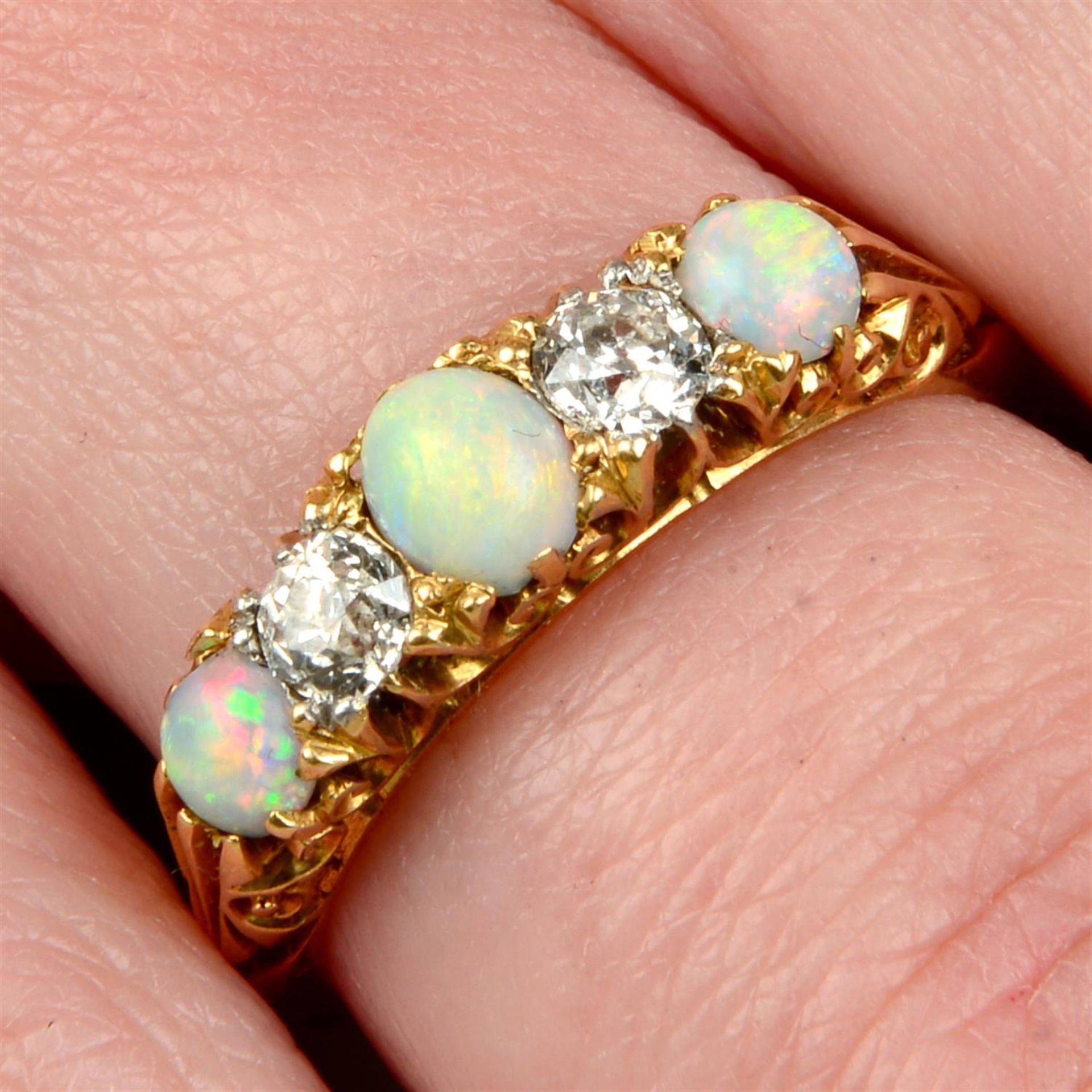 A Victorian 18ct gold opal and old-cut diamond five-stone ring.