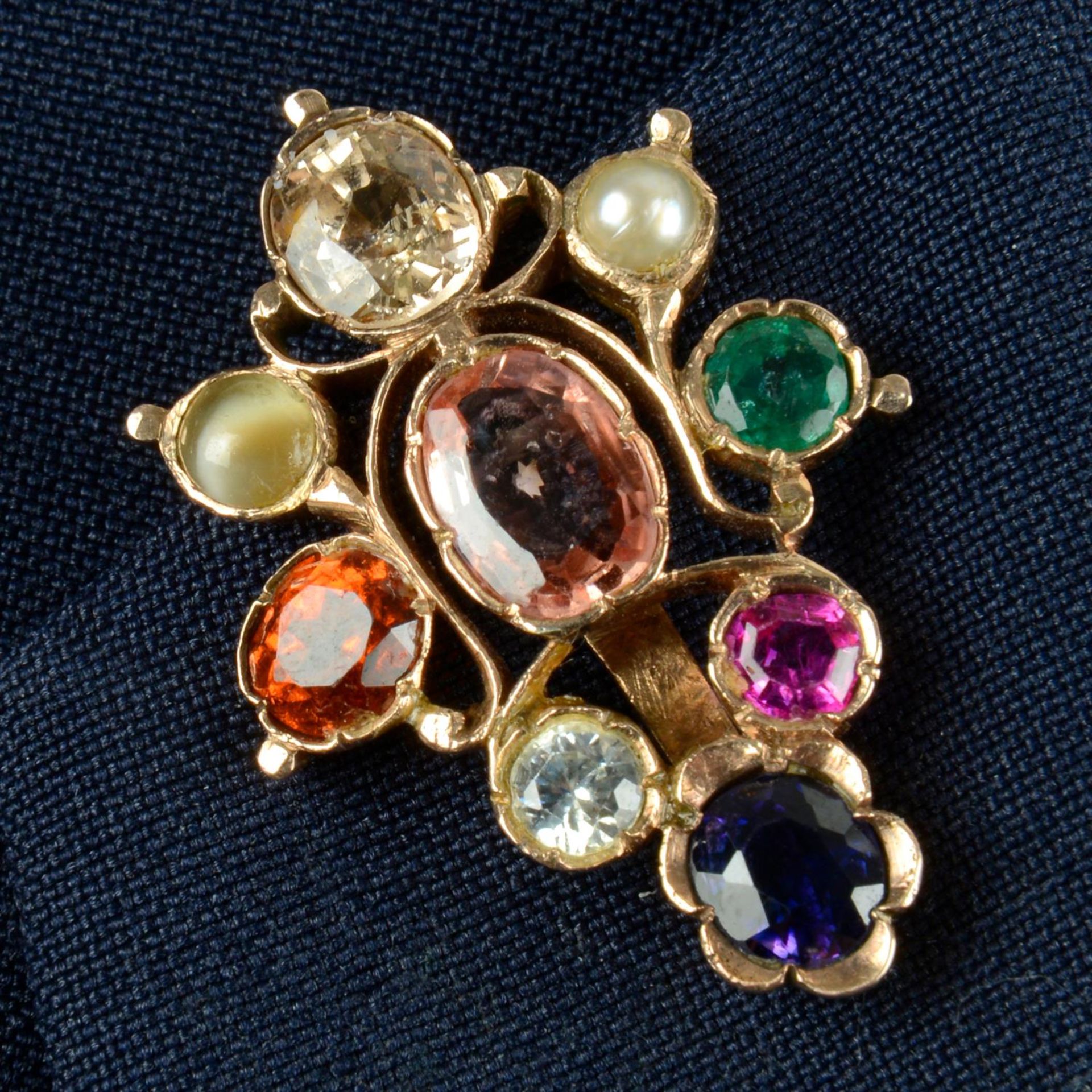 An early to mid 20th century gold Navaratna type clip, the Sri Lankan peach sapphire with yellow,