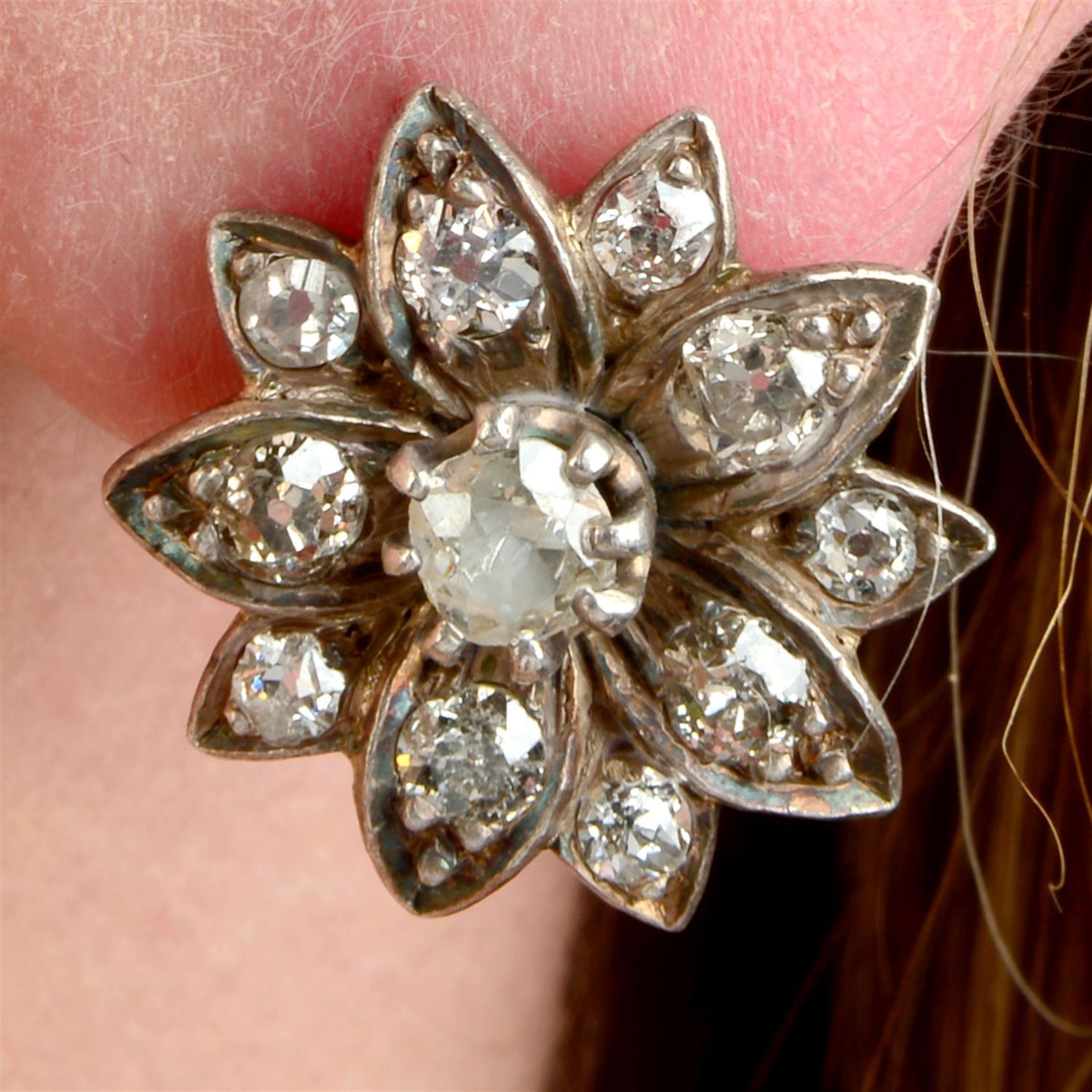 A pair of late Victorian silver and gold old-cut diamond floral earrings.