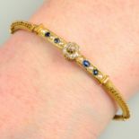 A mid Victorian gold old-cut diamond, sapphire and split pearl cannetille hinged bangle.