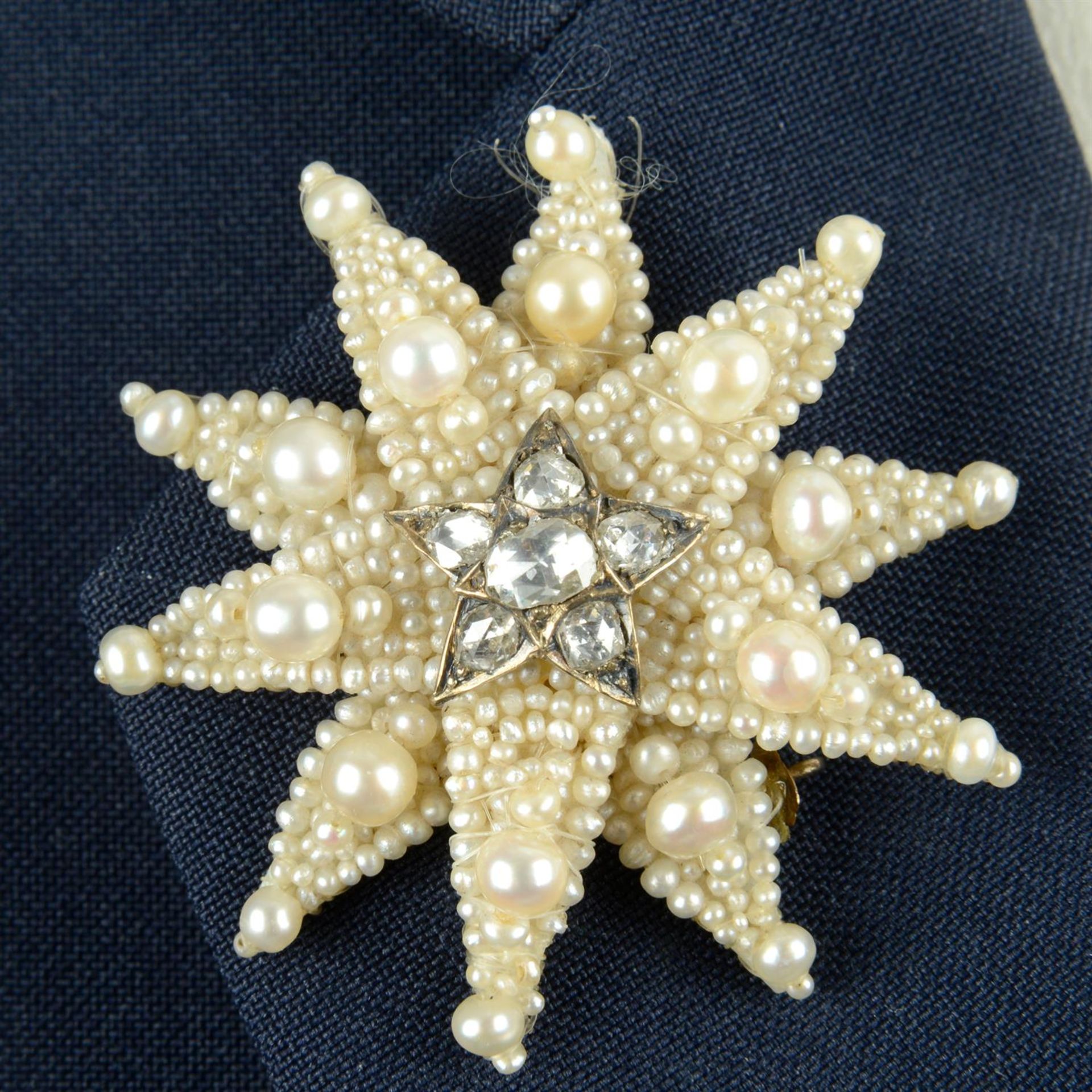 A 19th century rose-cut diamond, pearl and seed pearl star brooch.