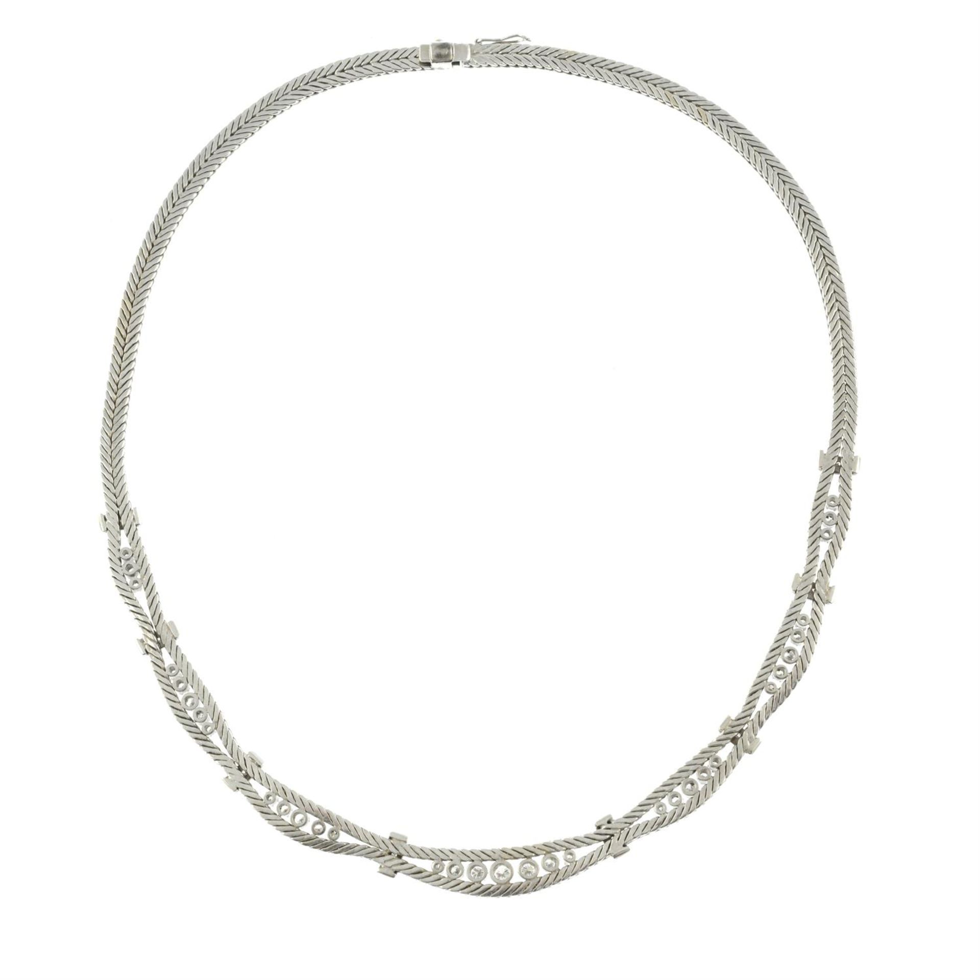 A mid 20th century 18ct gold textured herringbone-link necklace, with brilliant-cut diamond spacers. - Image 4 of 4