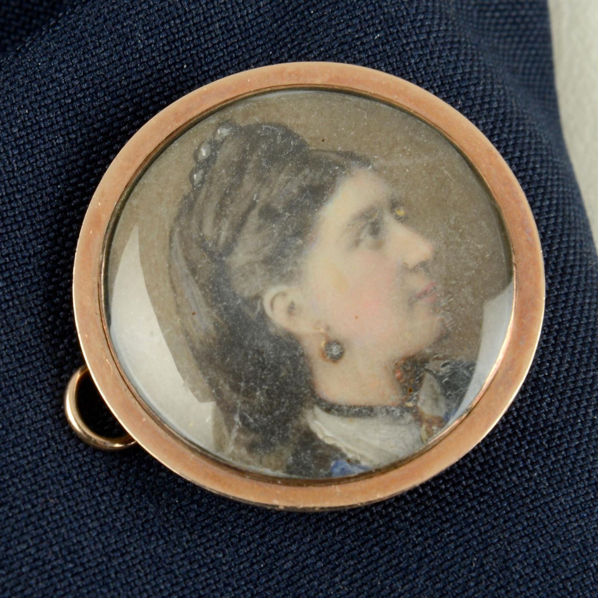 A late 19th century portrait miniature brooch/pendant, with locket reverse.