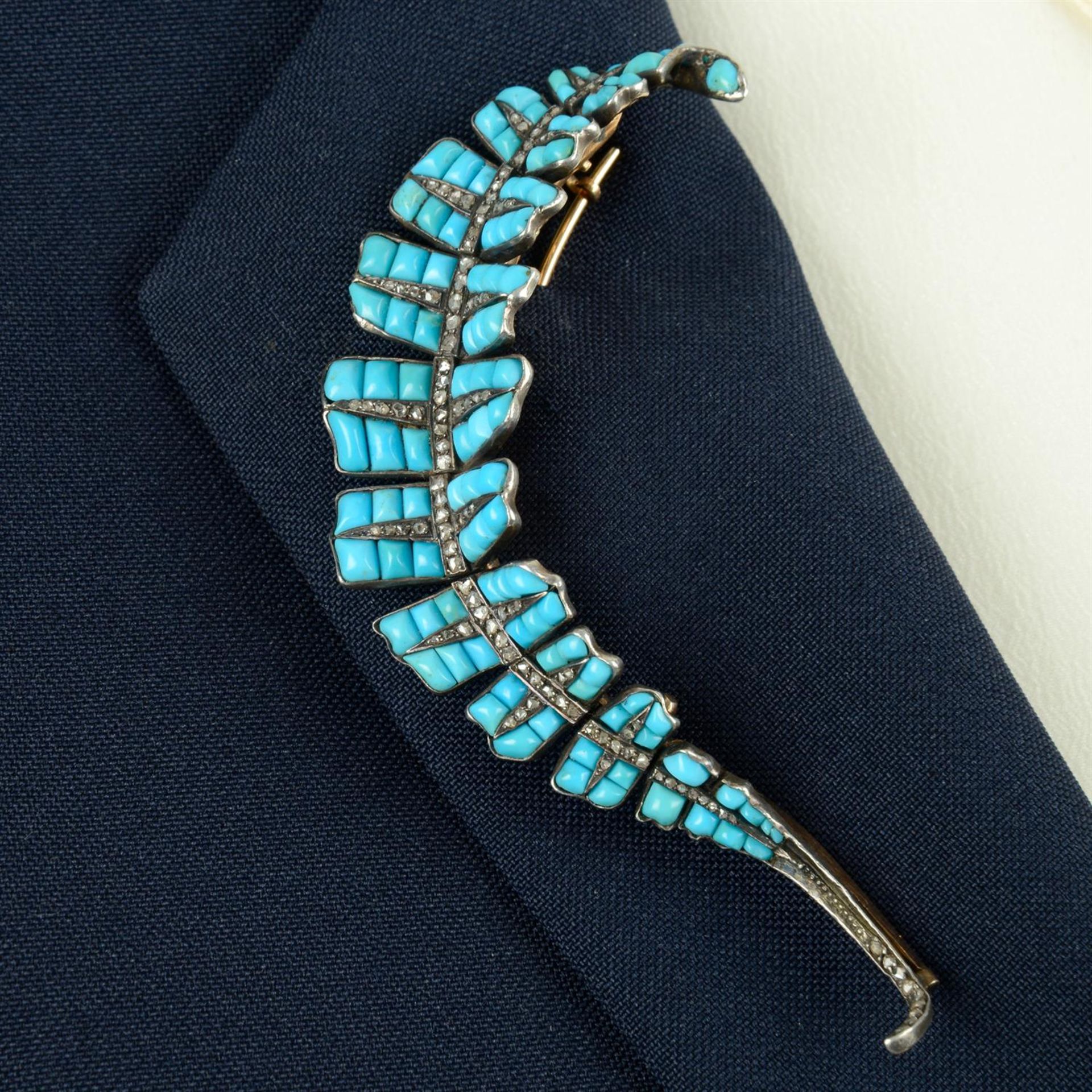 A 19th century silver and gold, calibre-cut turquoise and diamond point feather brooch.