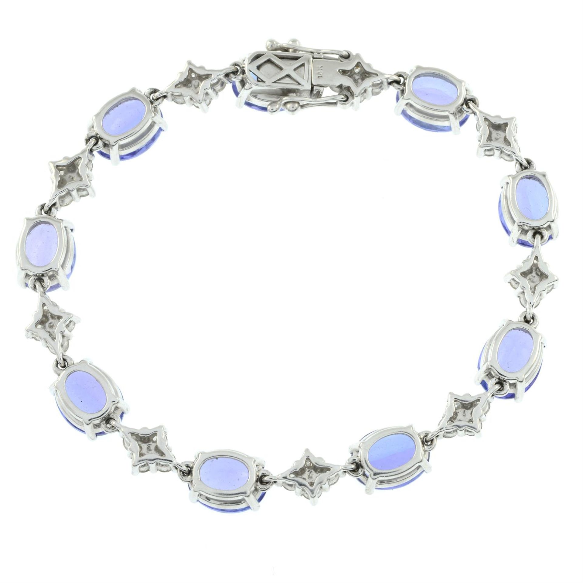 A tanzanite line bracelet, with brilliant-cut diamond quatrefoil spacers. - Image 3 of 3