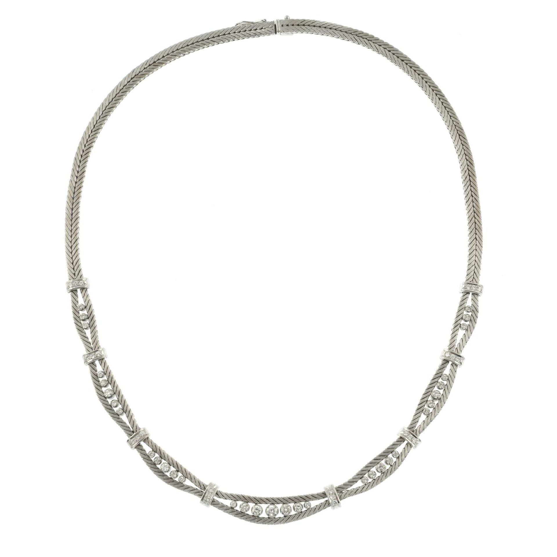 A mid 20th century 18ct gold textured herringbone-link necklace, with brilliant-cut diamond spacers. - Image 3 of 4