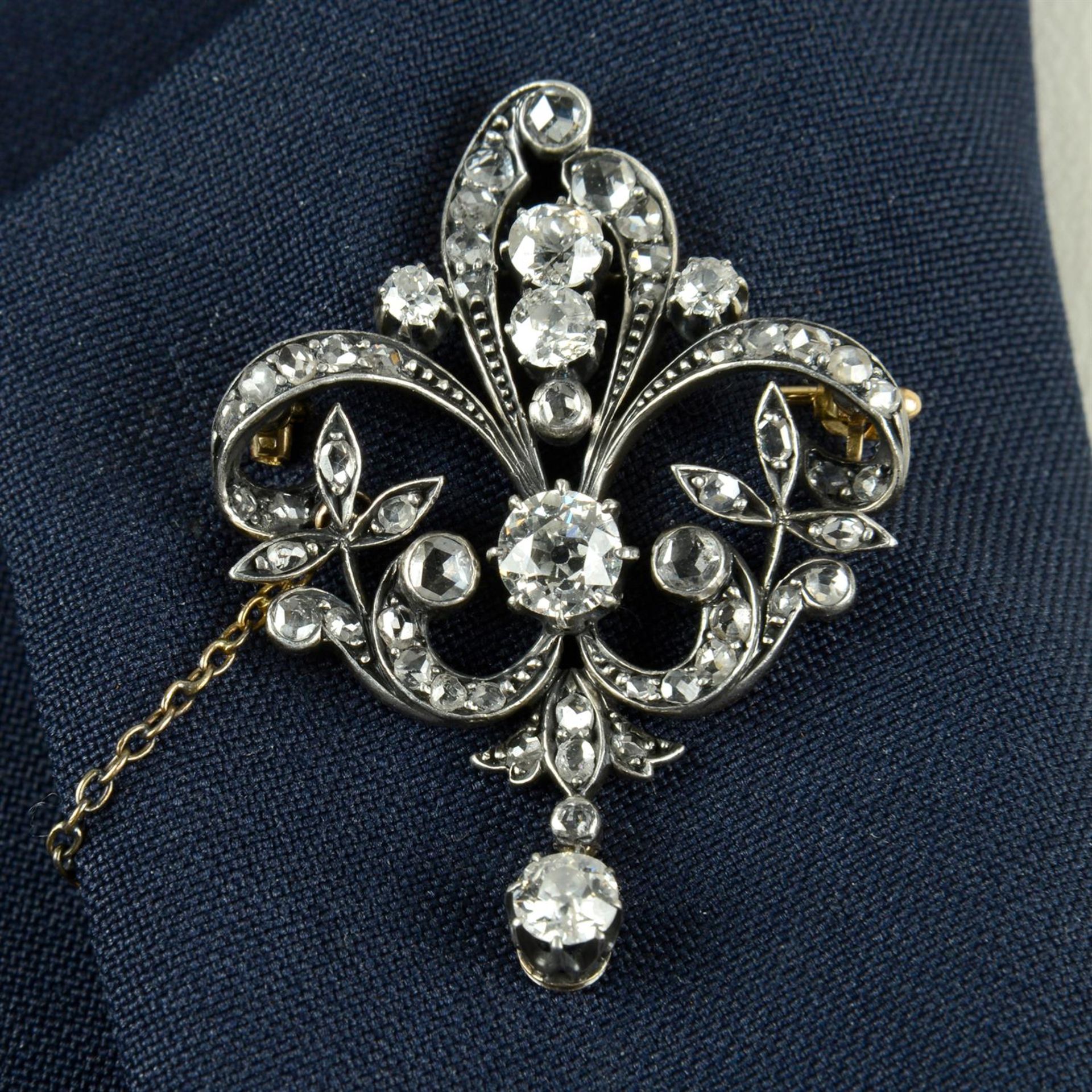 A late Victorian silver and gold, old and rose-cut diamond floral brooch.