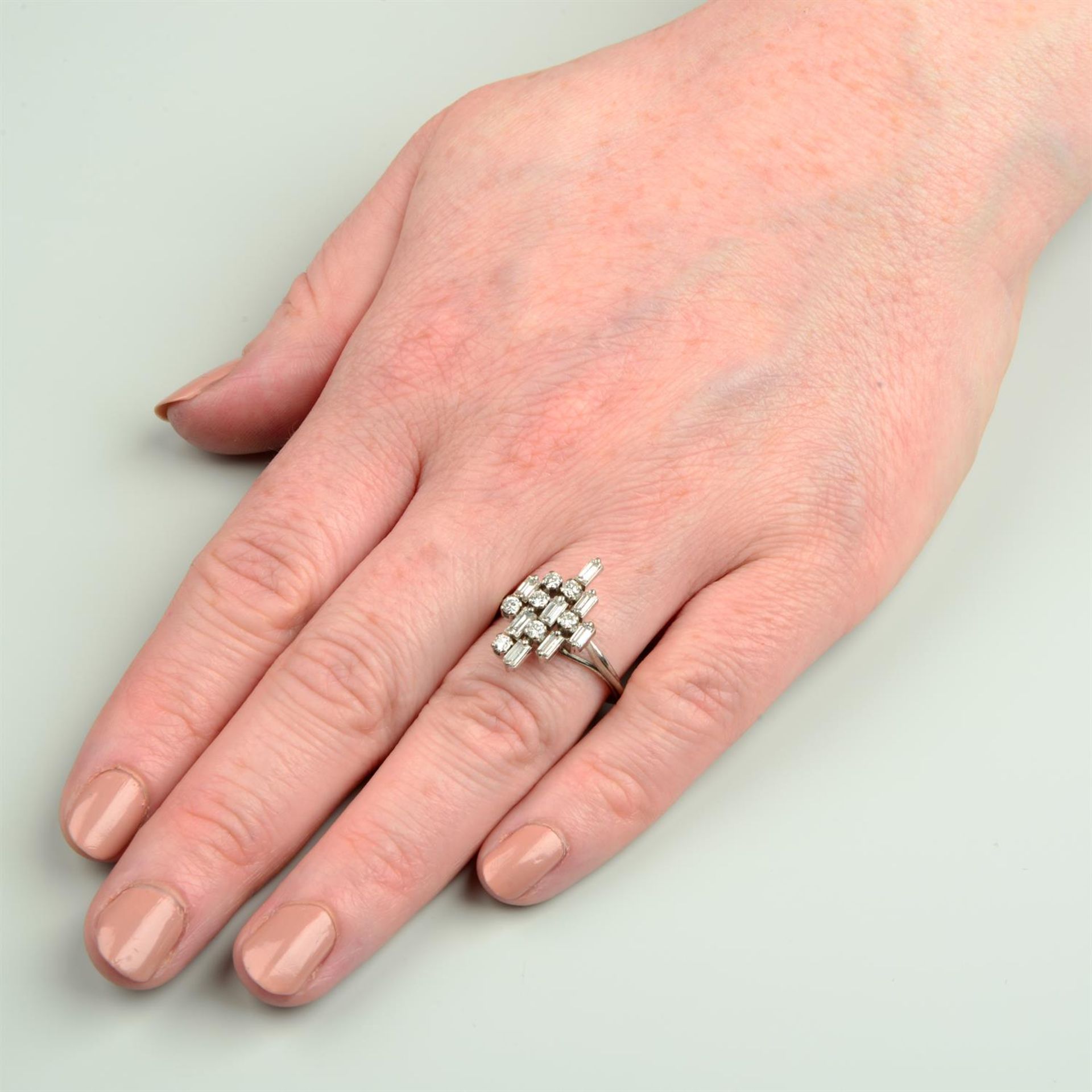 A mid 20th century platinum and gold brilliant and baguette-cut diamond dress ring. - Image 5 of 5