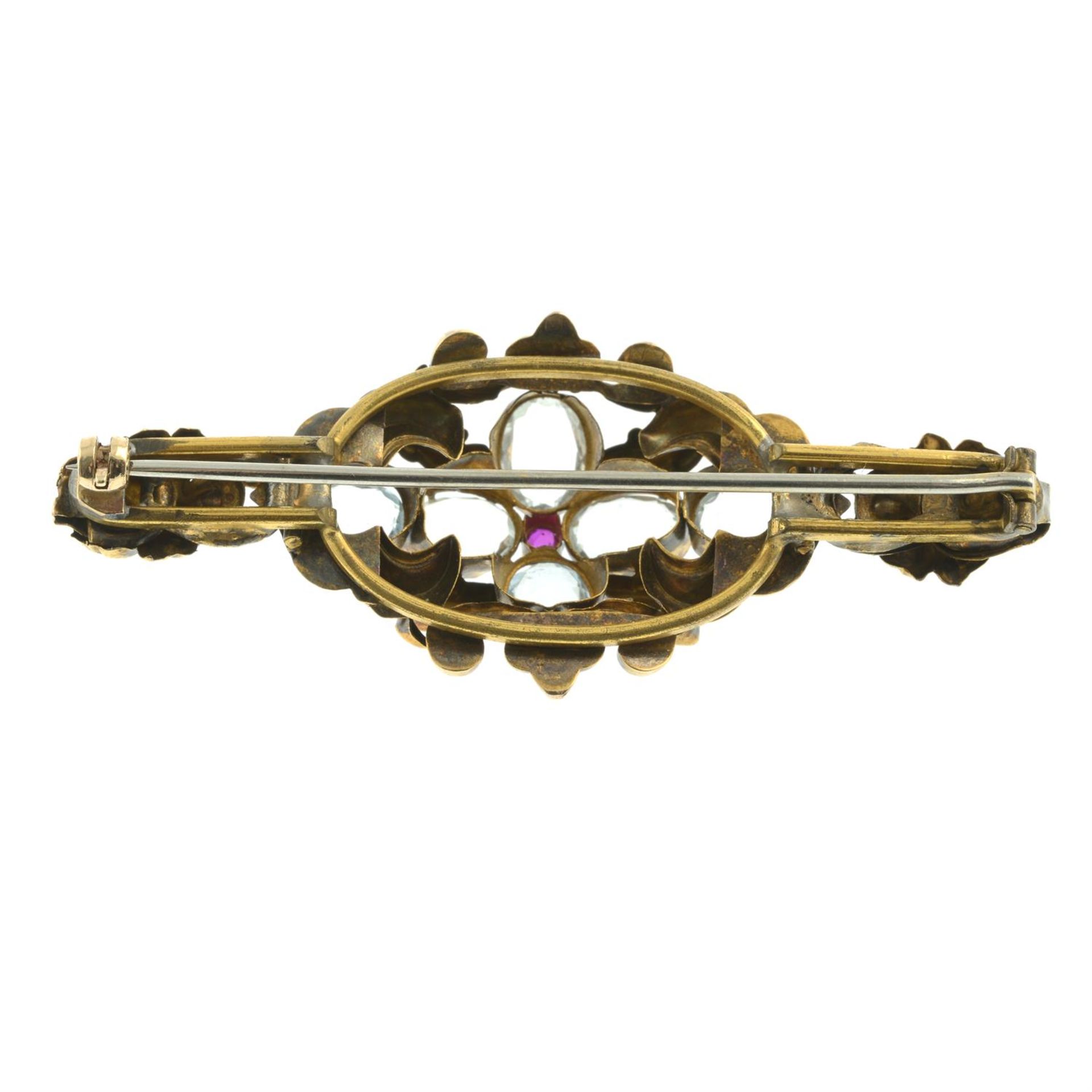 A mid 19th century gold aquamarine and ruby scrolling foliate brooch. - Image 3 of 4