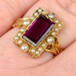 A late 19th century gold purple garnet, split and seed pearl cluster ring, with black enamel accent
