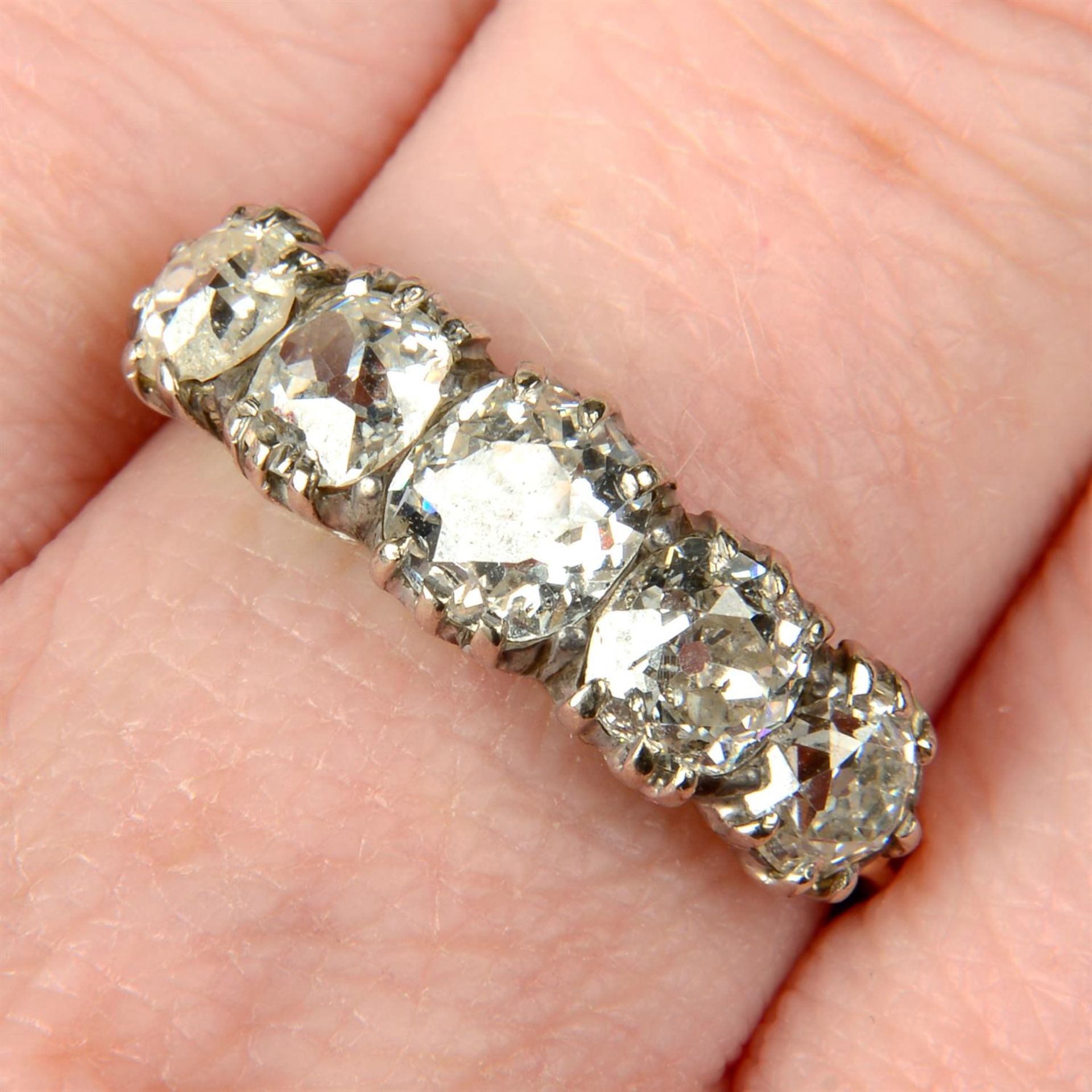 A late Victorian silver and 15ct gold graduated old-cut diamond five-stone ring.