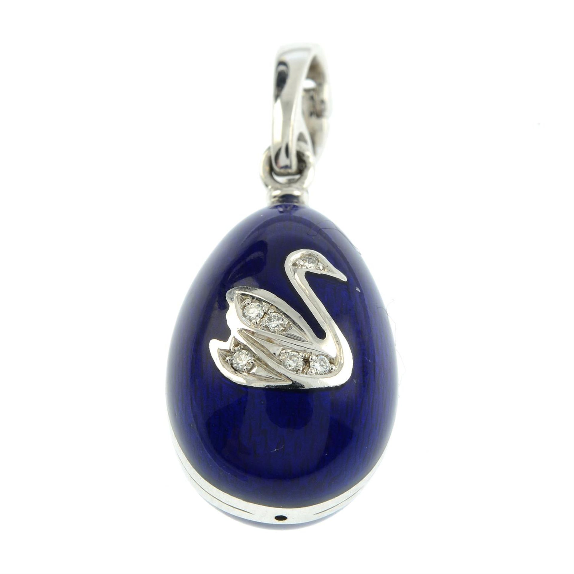 A limited edition 18ct gold blue enamel egg pendant, with diamond swan highlight, by Fabergé. - Image 2 of 5