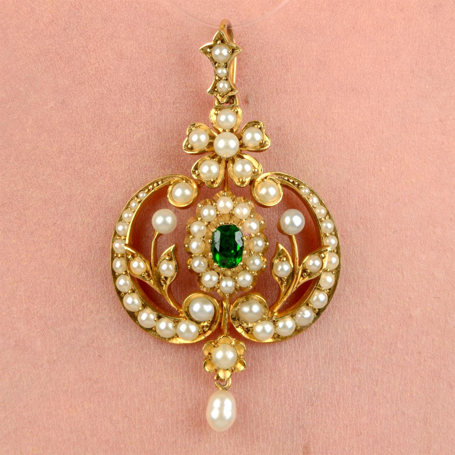 An early 20th century gold tsavorite garnet, seed and split pearl pendant.