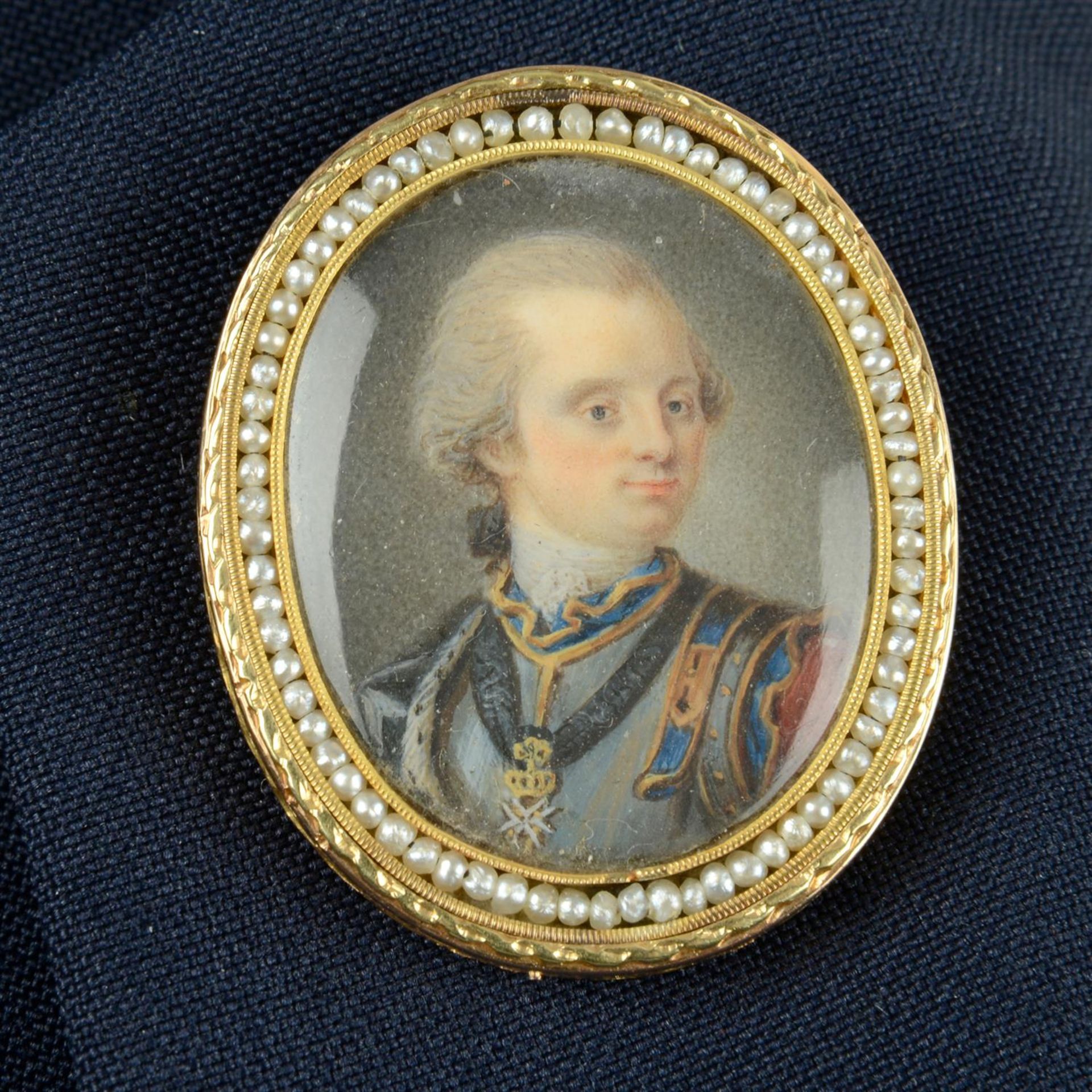 An early 19th century 18ct gold miniature portrait brooch, with seed pearl surround,