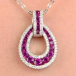 An 18ct gold ruby and diamond pendant, with chain.