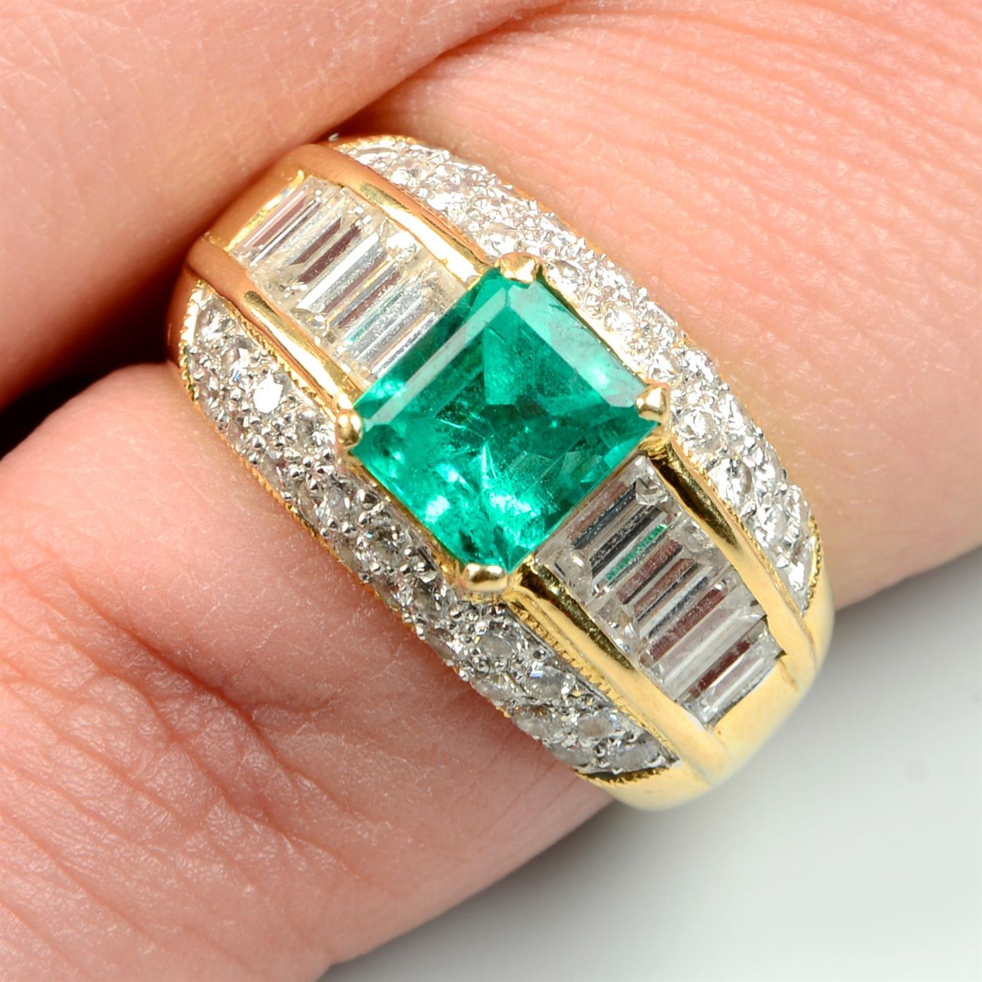 A Colombian emerald, baguette-shape and brilliant-cut diamond dress ring.