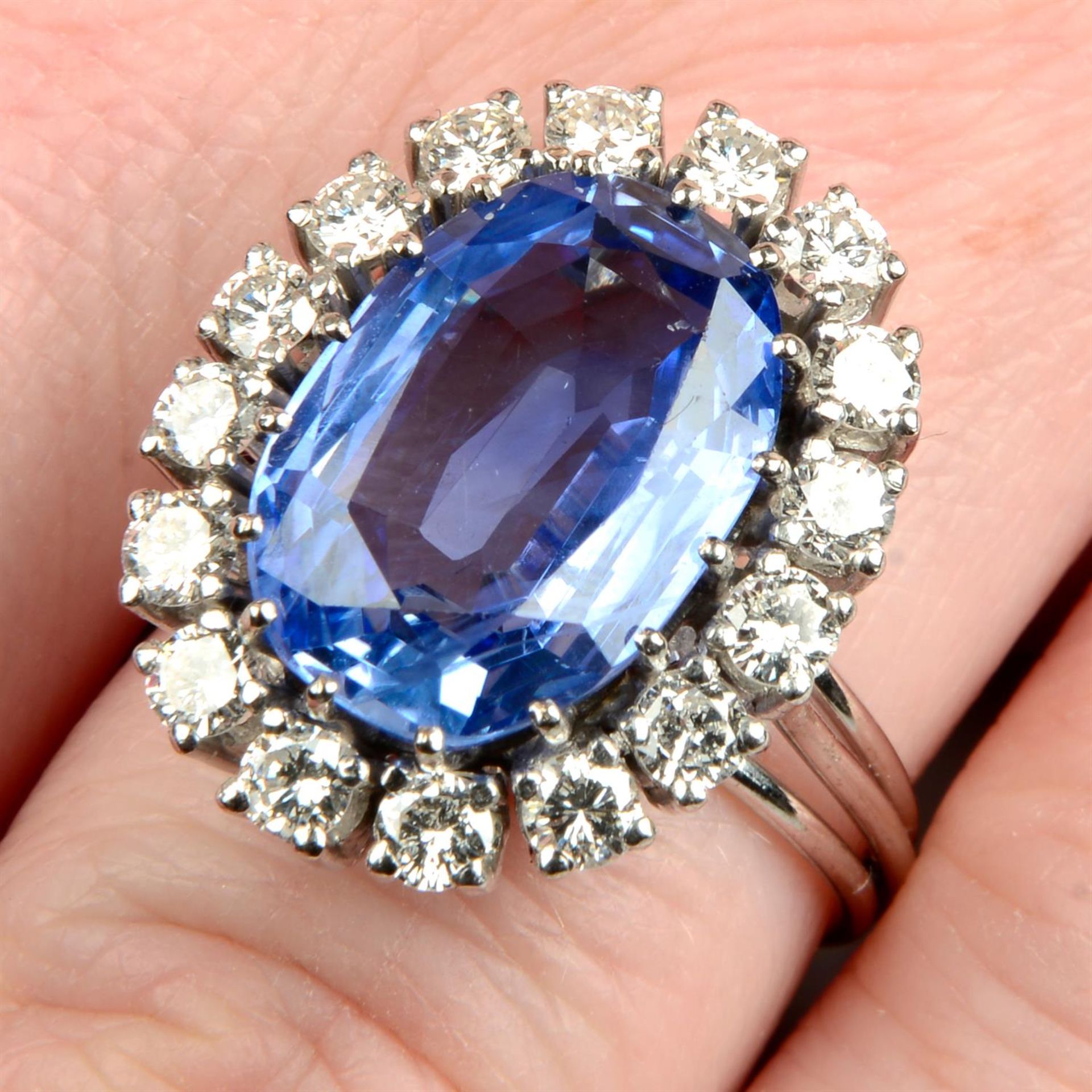 A mid 20th century Sri Lankan sapphire and brilliant-cut diamond cluster ring.