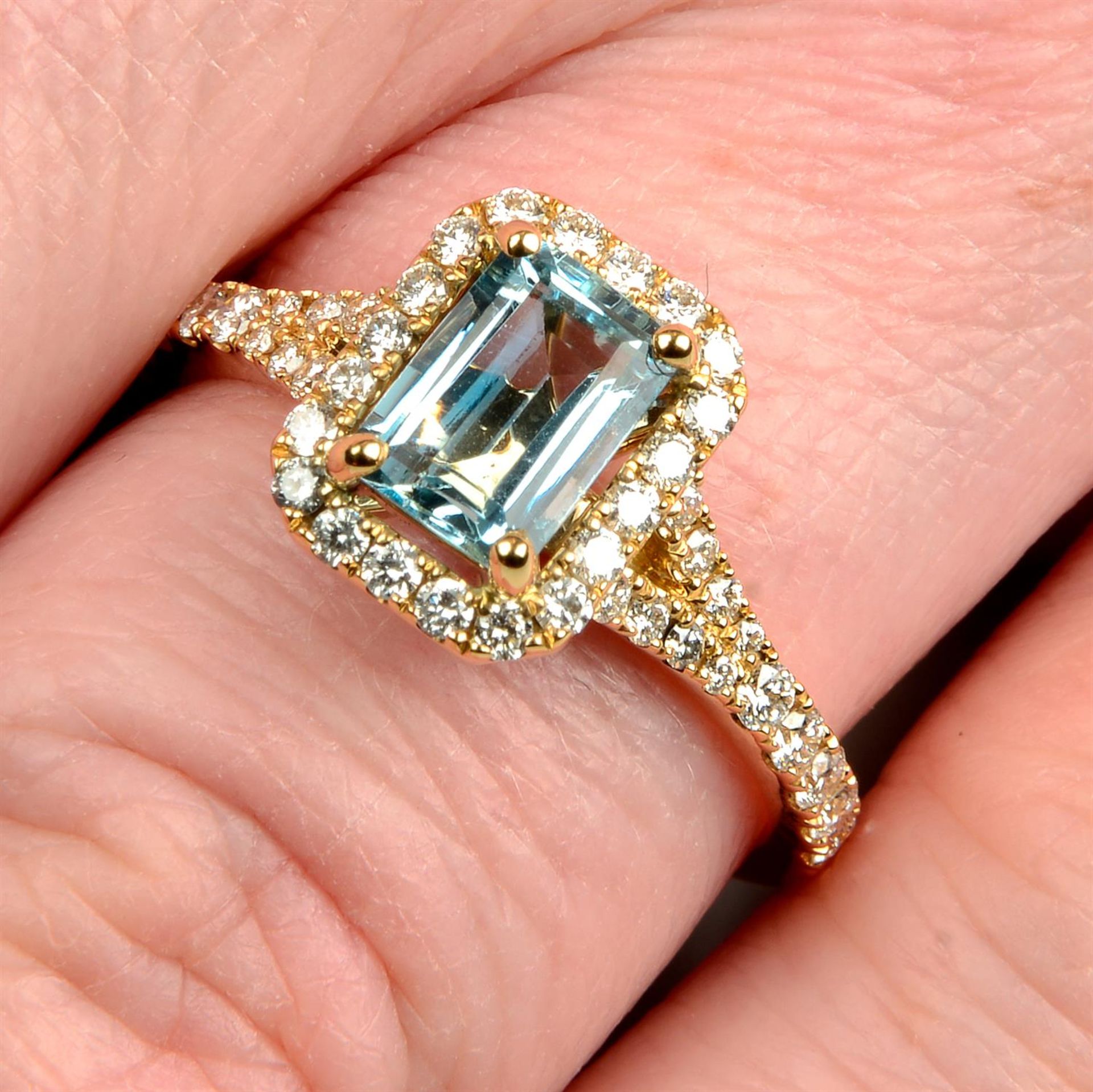 An 18ct gold aquamarine and brilliant-cut diamond dress ring.