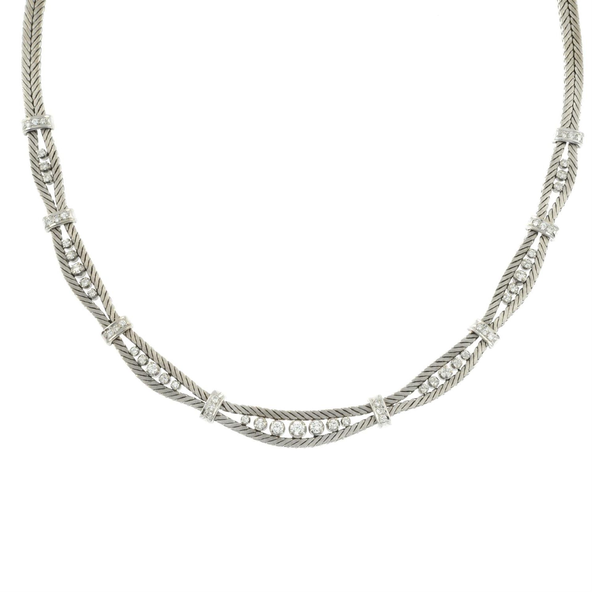 A mid 20th century 18ct gold textured herringbone-link necklace, with brilliant-cut diamond spacers. - Image 2 of 4