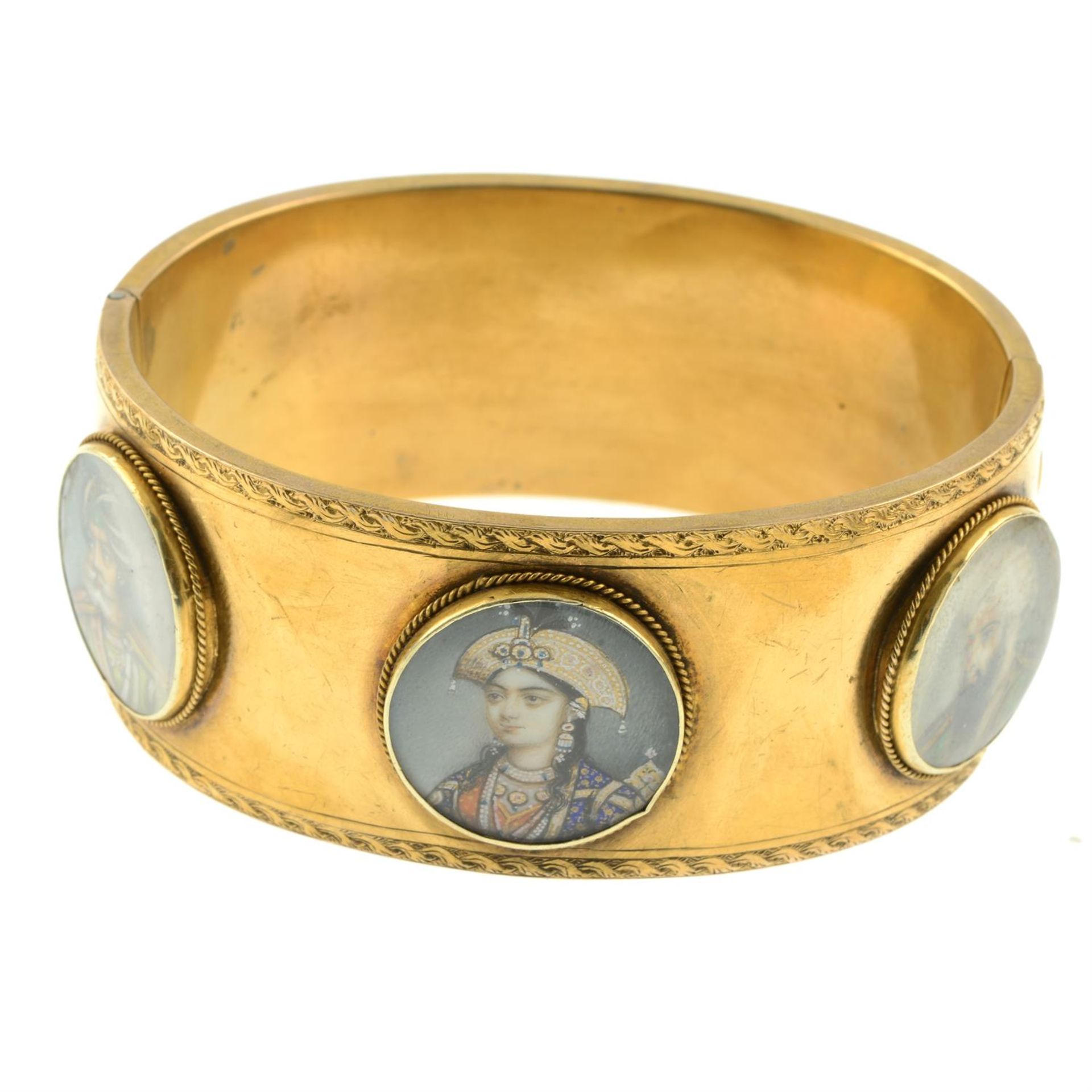 A mid 19th century gold hinged bangle, set with six Mughal portrait miniature glazed panels and - Image 3 of 3