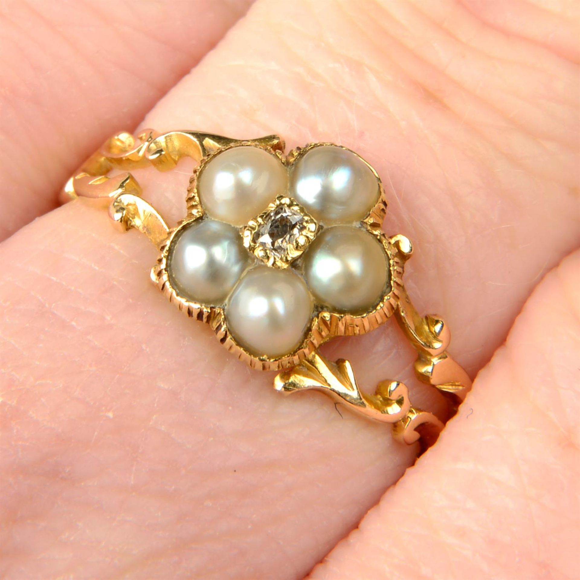 A mid 19th century 18ct gold old-cut diamond and split pearl floral cluster ring,
