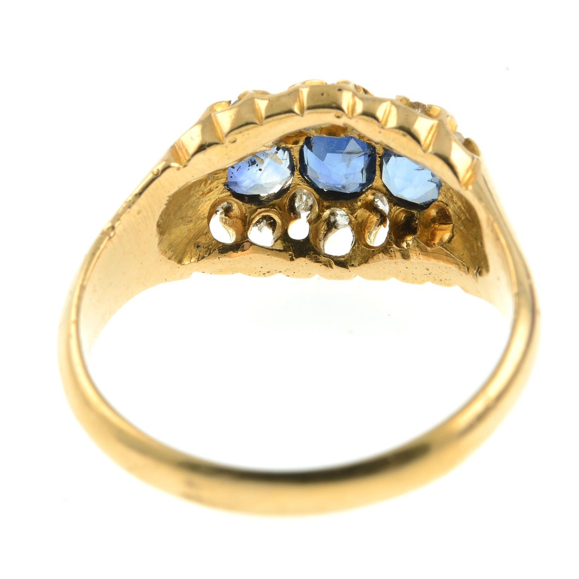 A late Victorian 18ct gold sapphire three-stone ring, with rose and old-cut diamond surround. - Image 4 of 6