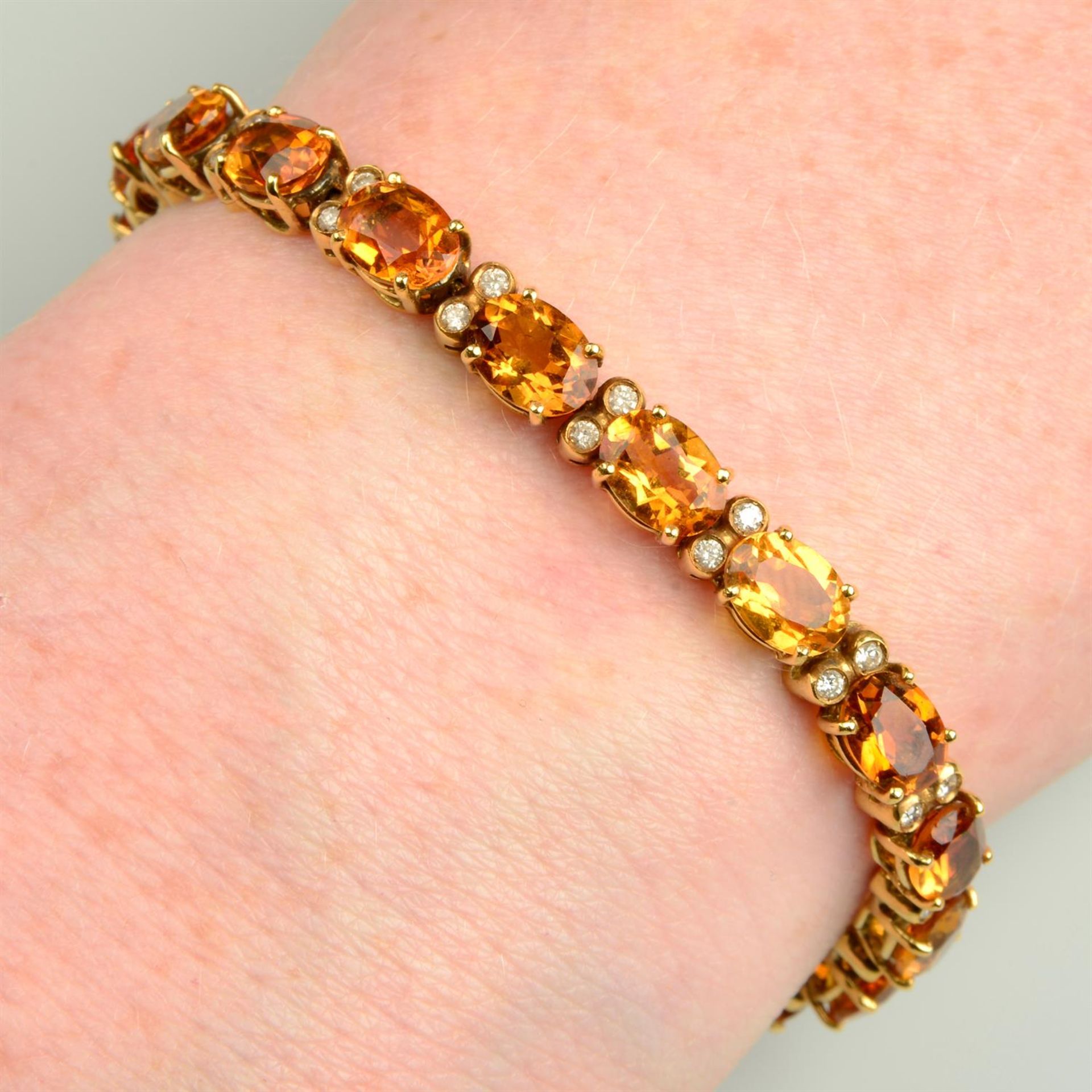 A citrine bracelet, with brilliant-cut diamond spacers.