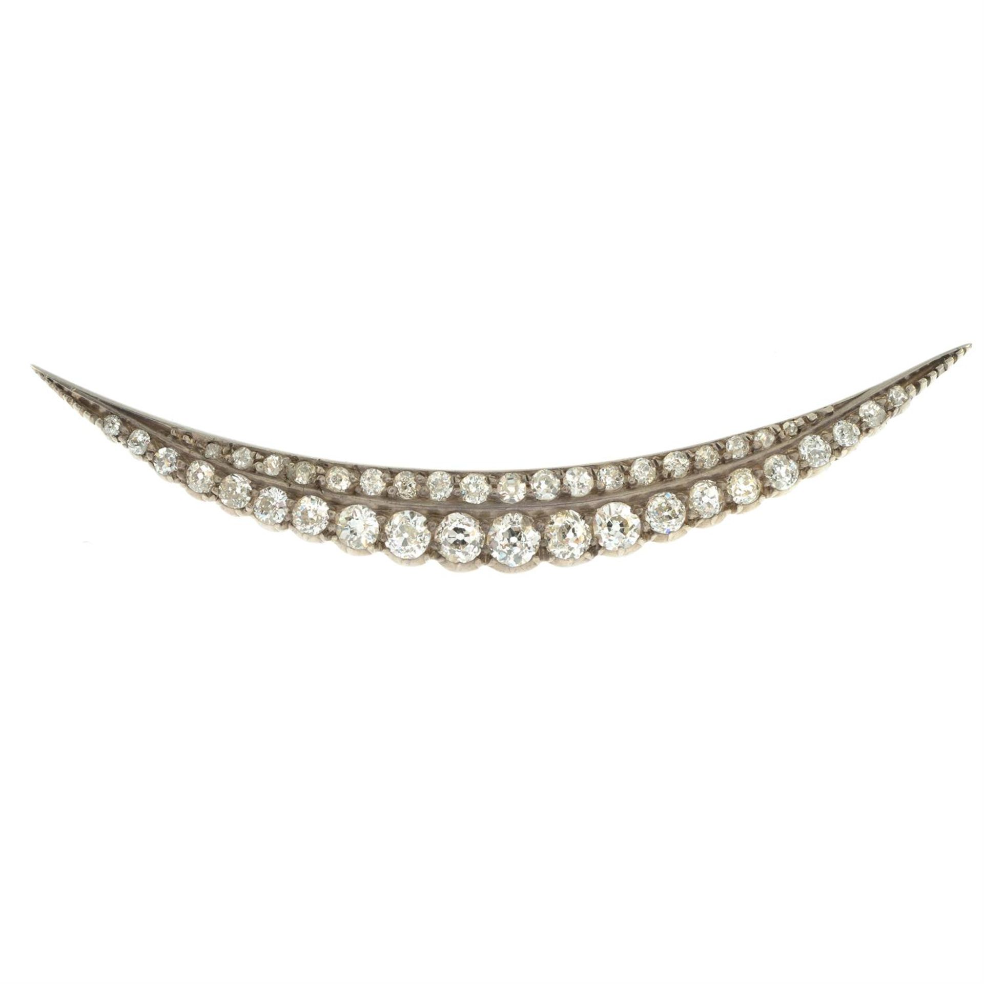 A late Victorian silver and gold old-cut diamond crescent brooch. - Image 2 of 4