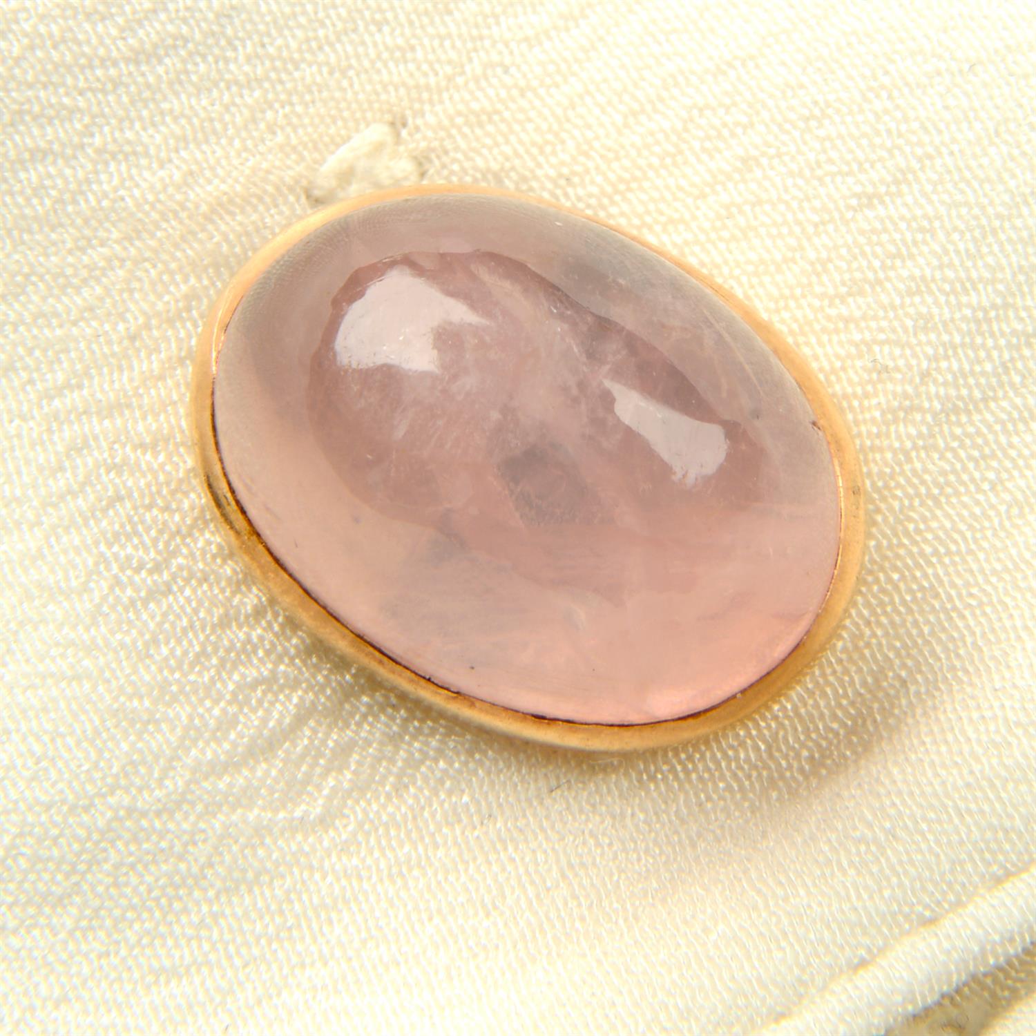 A pair of early to mid 20th century gold rose quartz cabochon cufflinks.