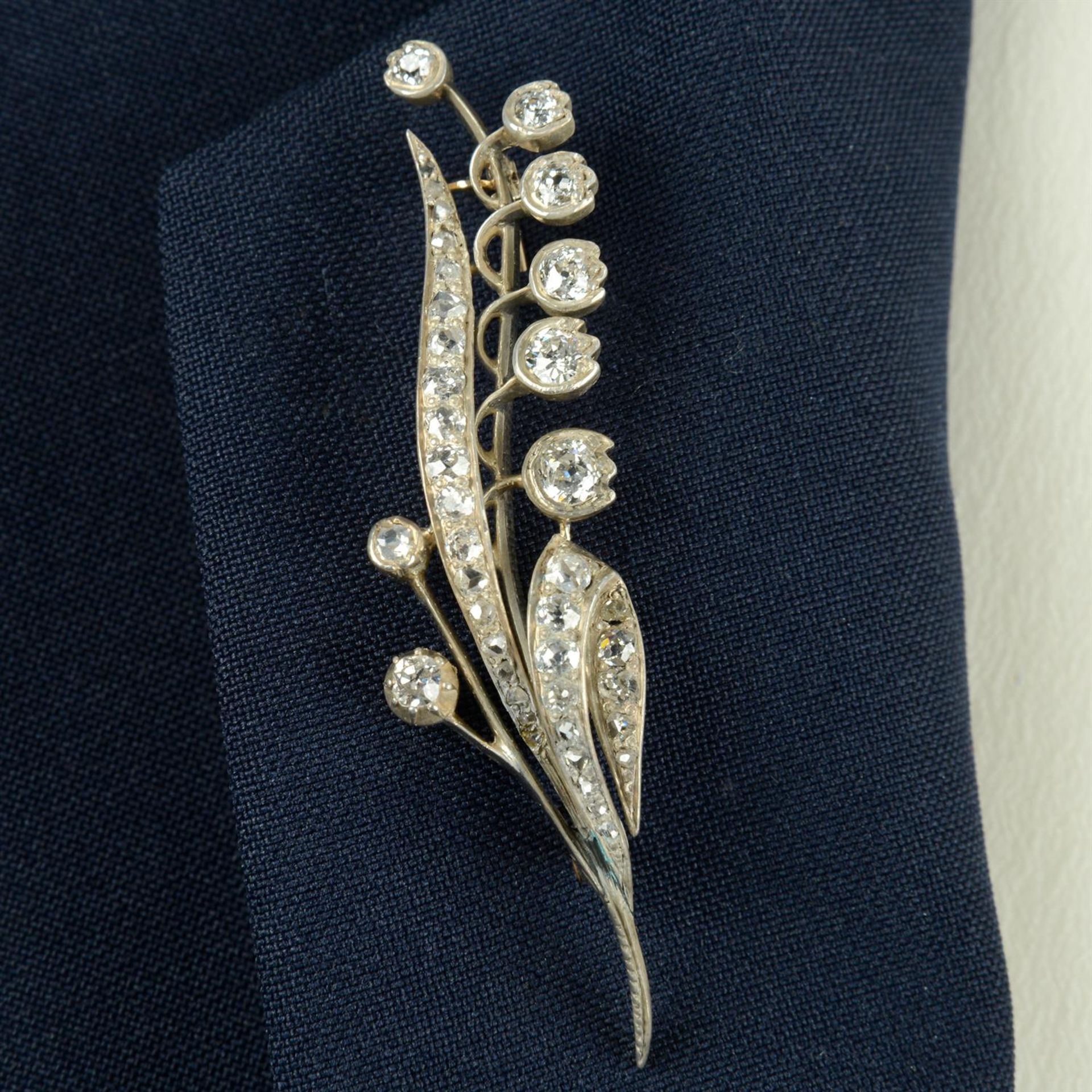 A late Victorian silver and gold old and rose-cut diamond floral Lily of the Valley brooch.